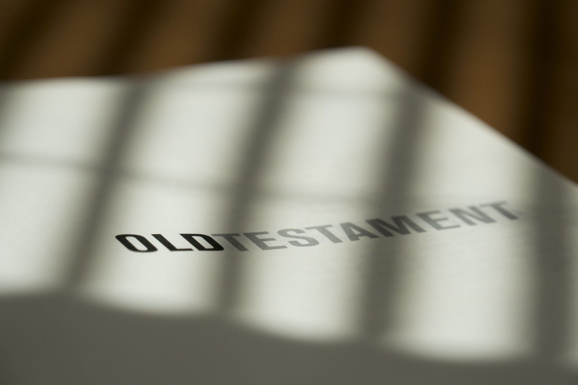 The word old testament is on a piece of paper