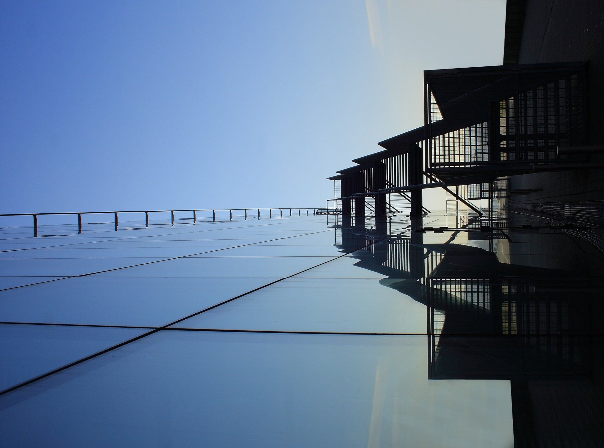 A building with stairs and a blue sky in the background