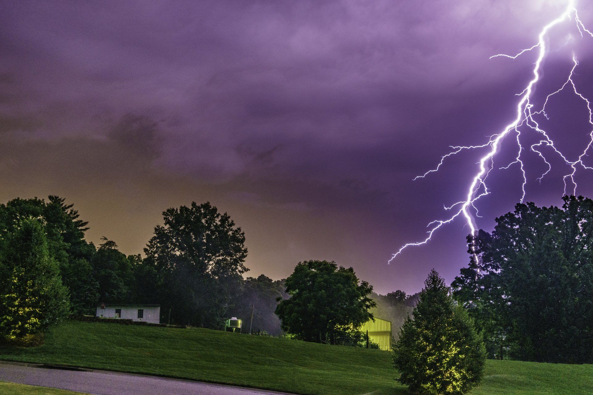 Lightning bolt striking a tree in the countryside