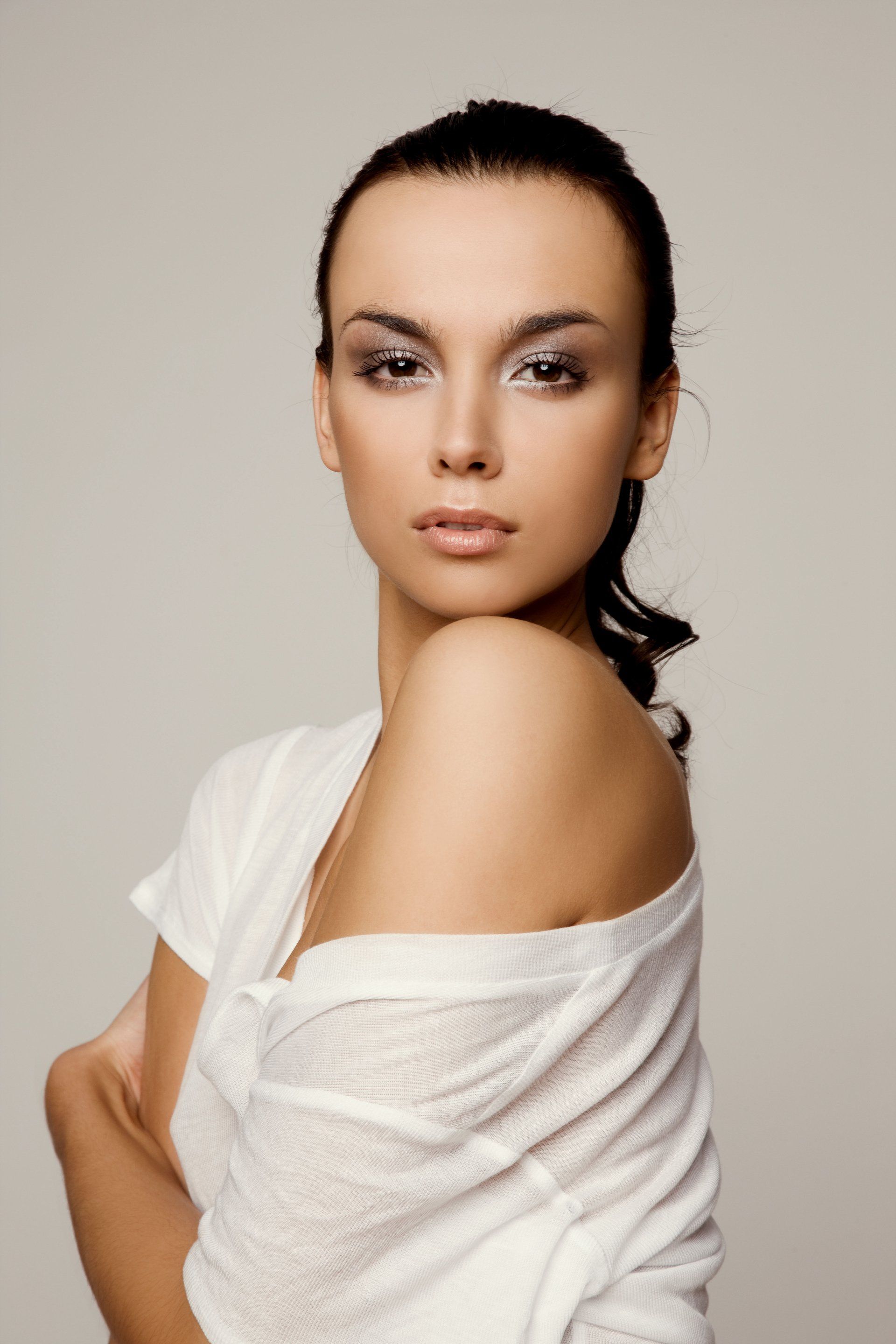 Woman with her hand on her chin at ERA Wellness Spa