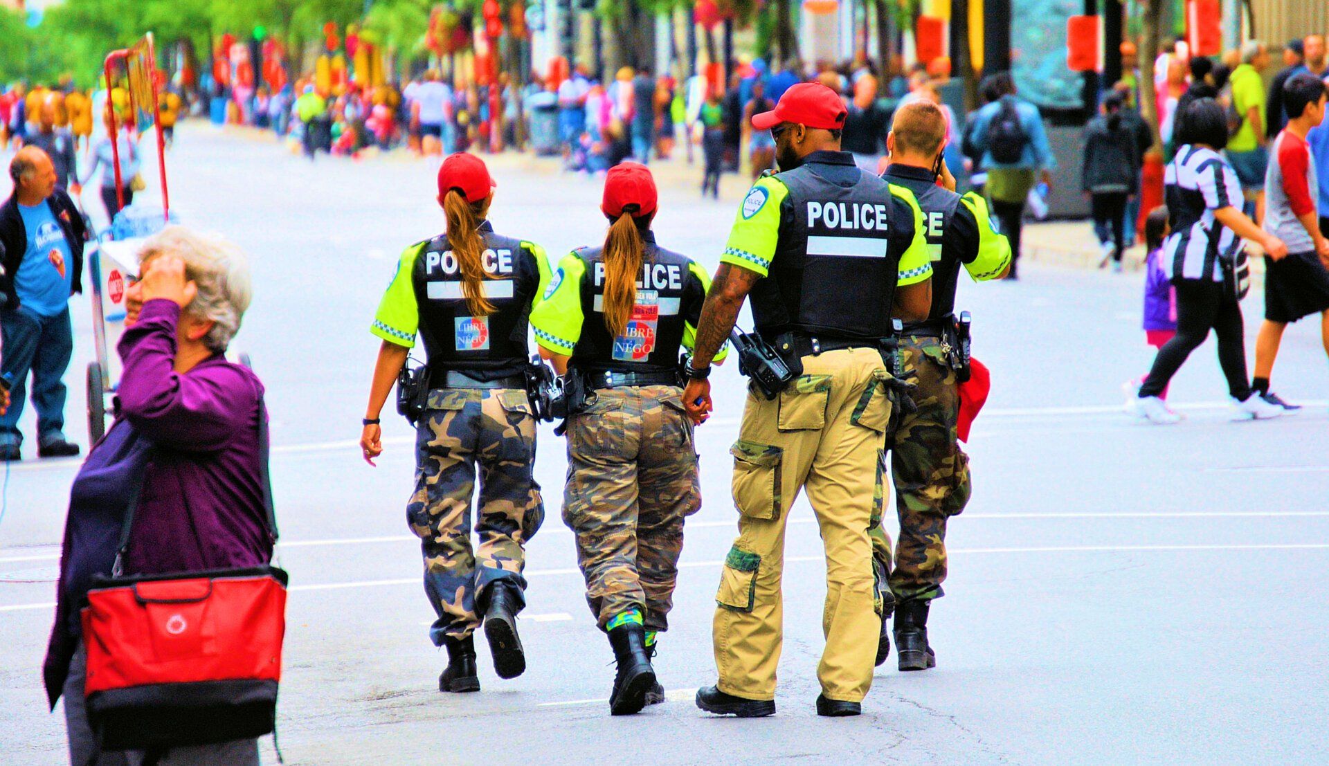 A group of police officers walking down a street