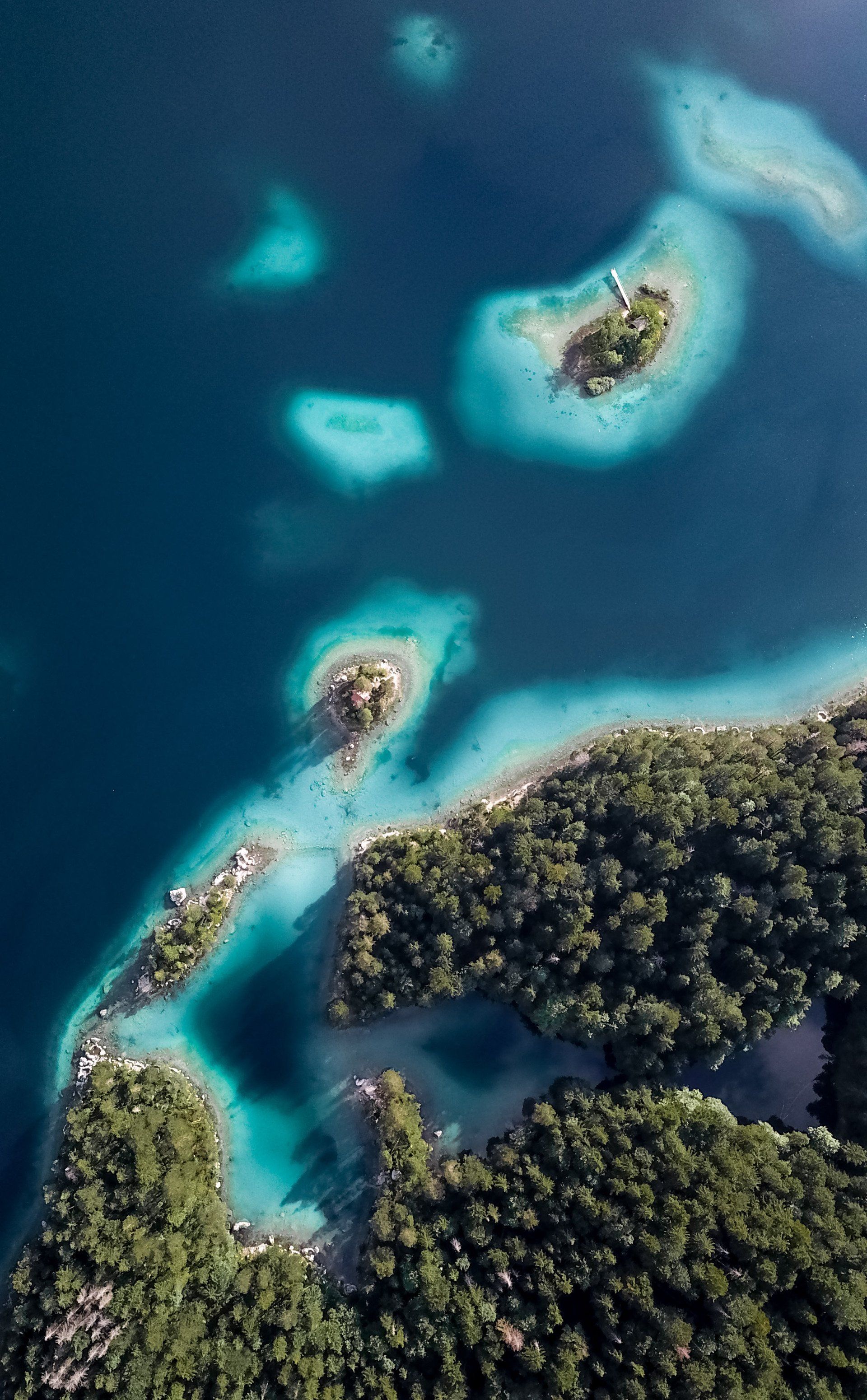 An aerial view of a lake with islands in it