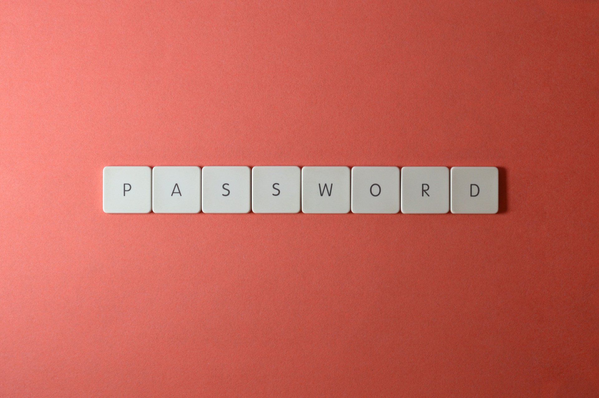 The word password is written in white tiles on a red background.
