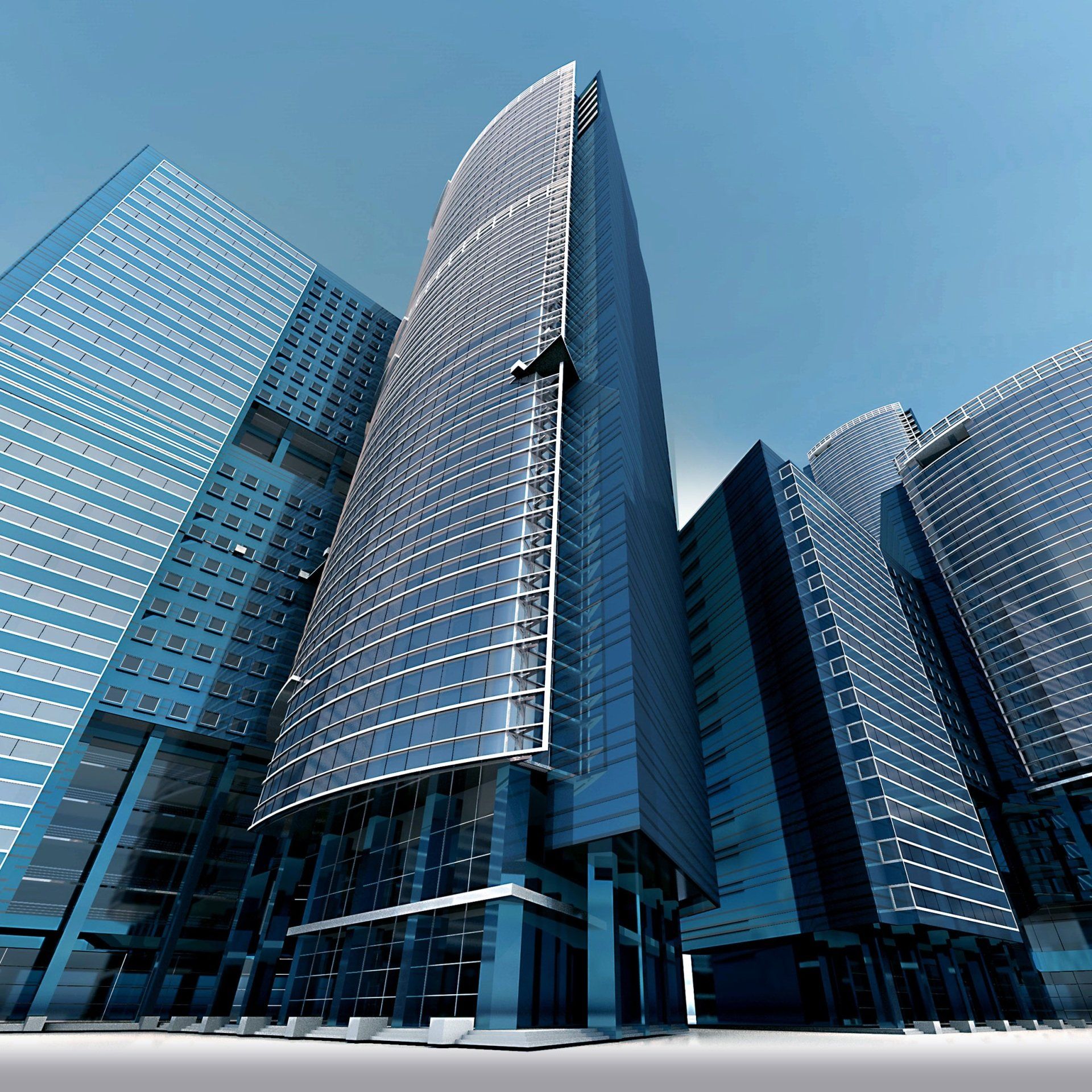 A group of tall buildings with a blue sky in the background