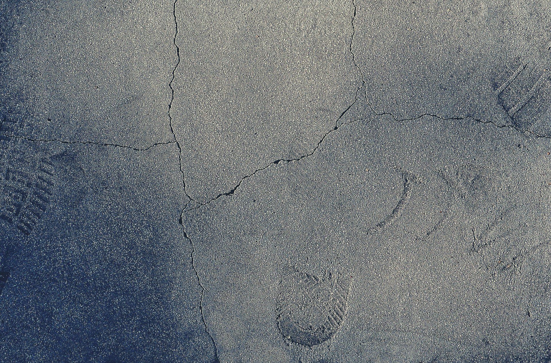 Close-up of a textured gray and blue surface with scattered speckles