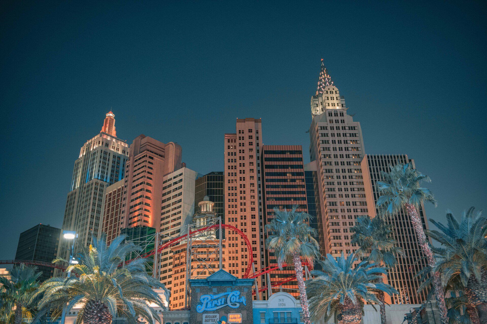 las vegas nevada city skyline at night with palm trees in the foreground