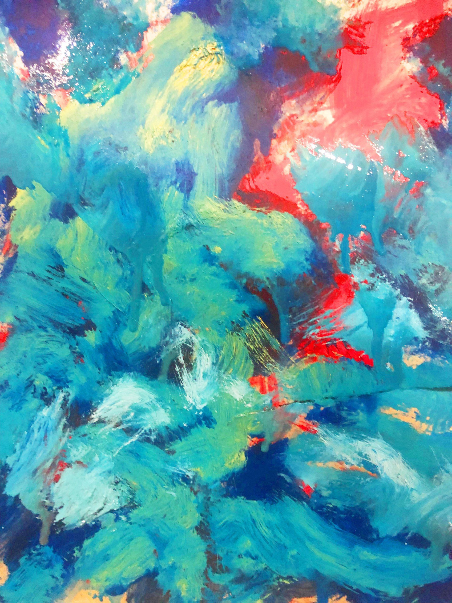A close up of a colorful painting with blue , red and yellow brush strokes.