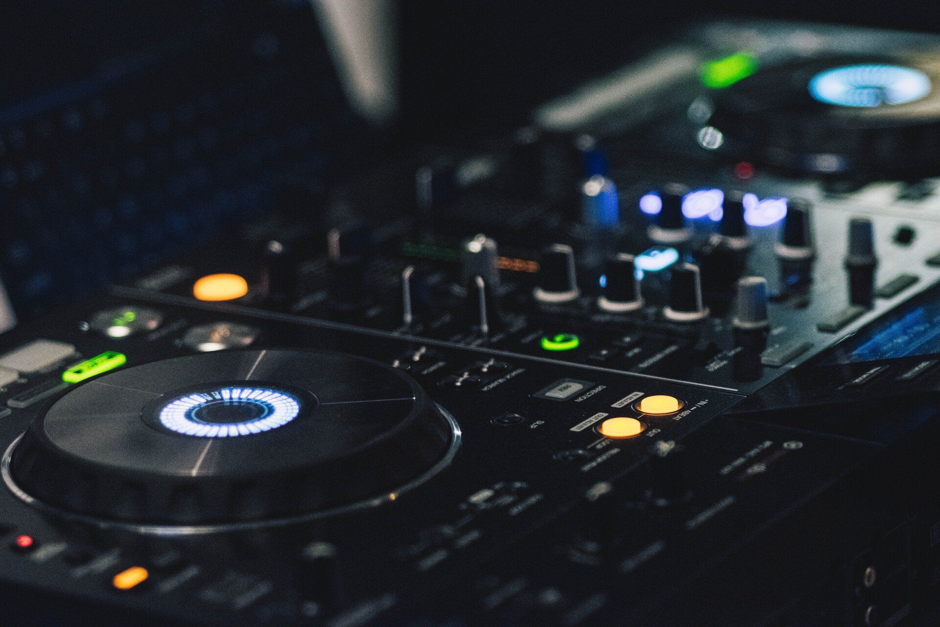 A close up of a dj 's controller with a circle on it.