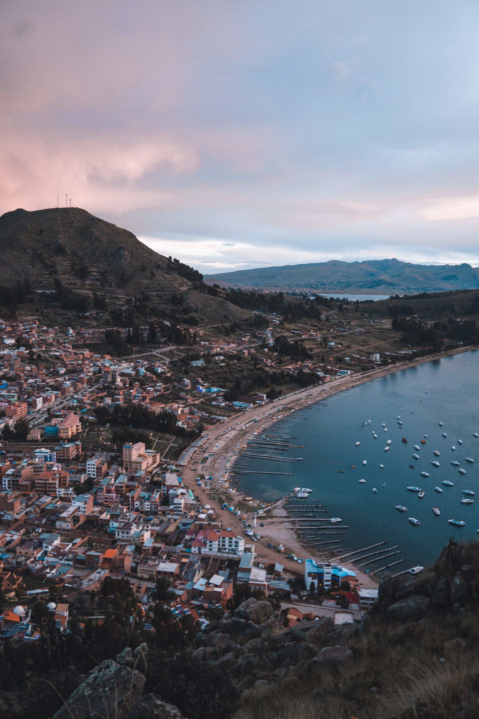 An aerial view of a small town next to a body of water.