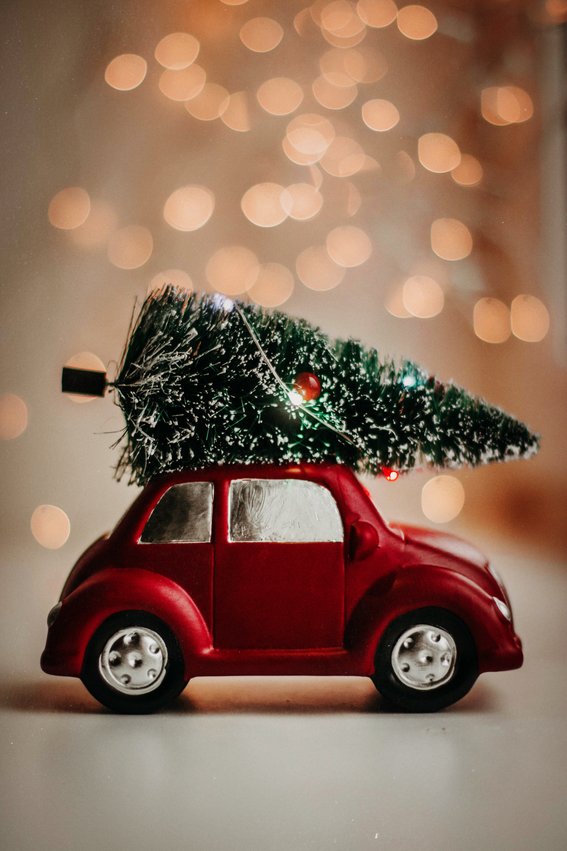 Red Car with a Christmas tree on the roof