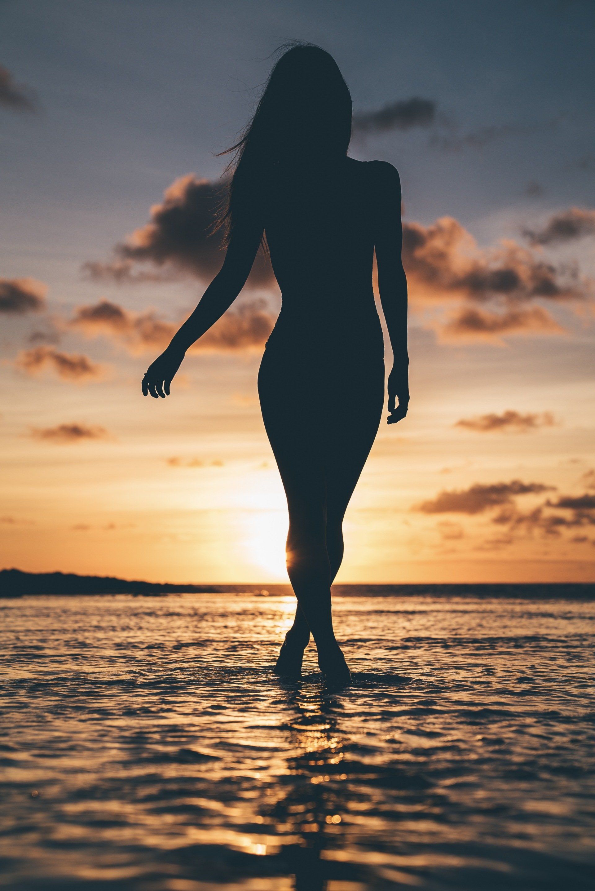 lady walking on the beach