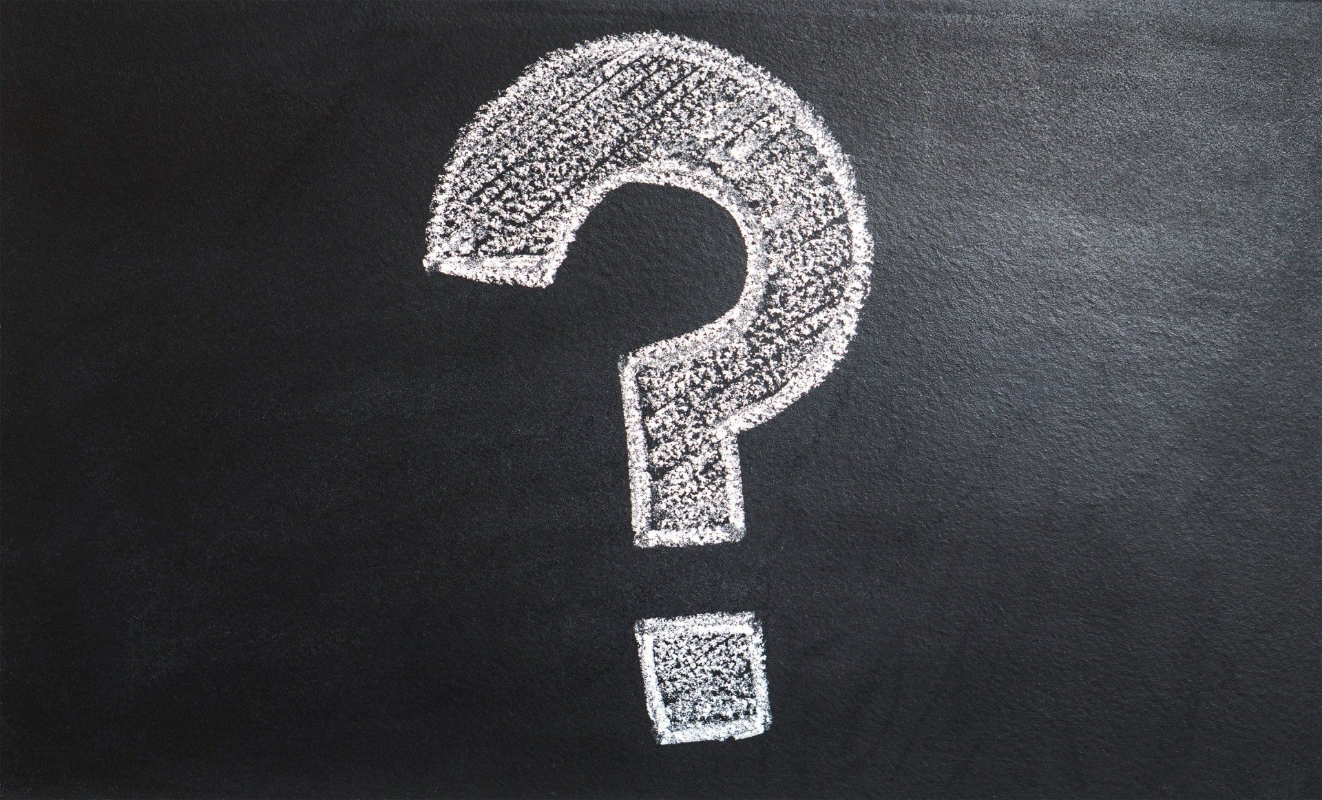 A picture of a chalkboard with a question mark on it