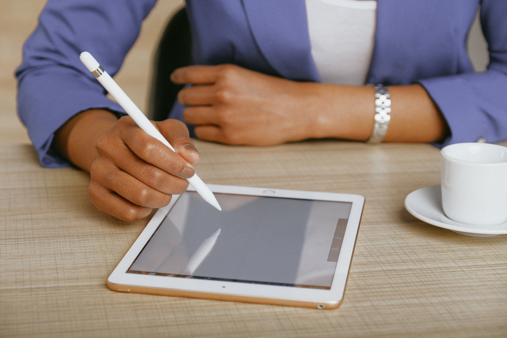 Person signing on tablet instead of paper