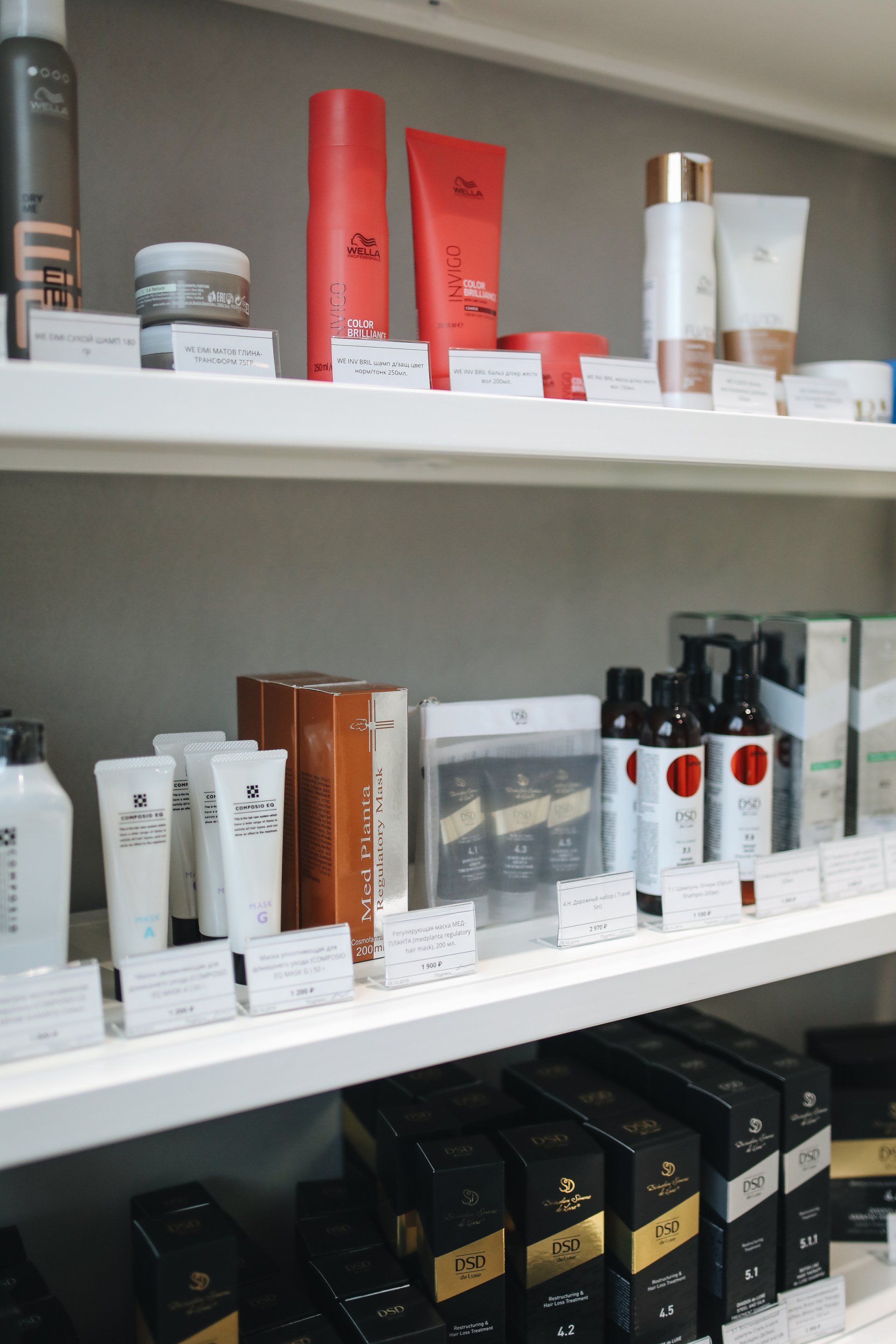 A shelf filled with a variety of beauty products