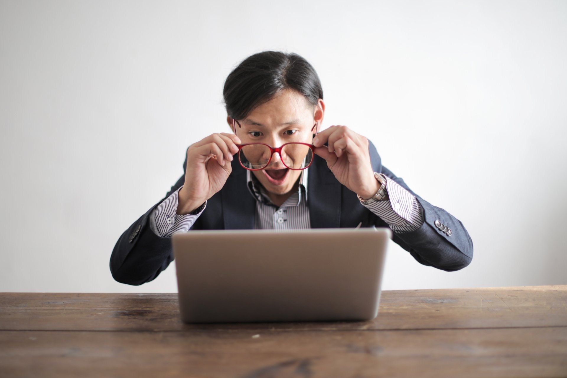 Person impressed about what they are reading on a computer.