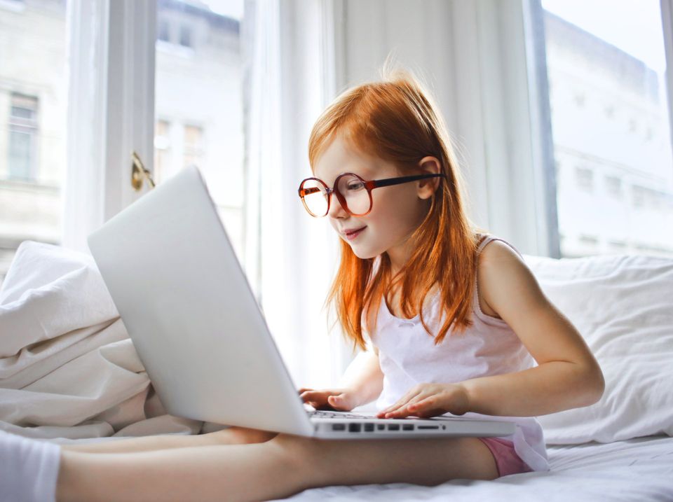 Girl with Glasses at Laptop Image