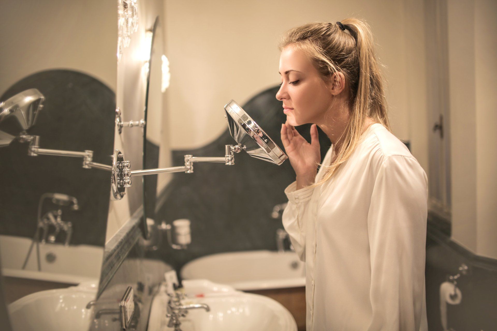 woman looking in mirror