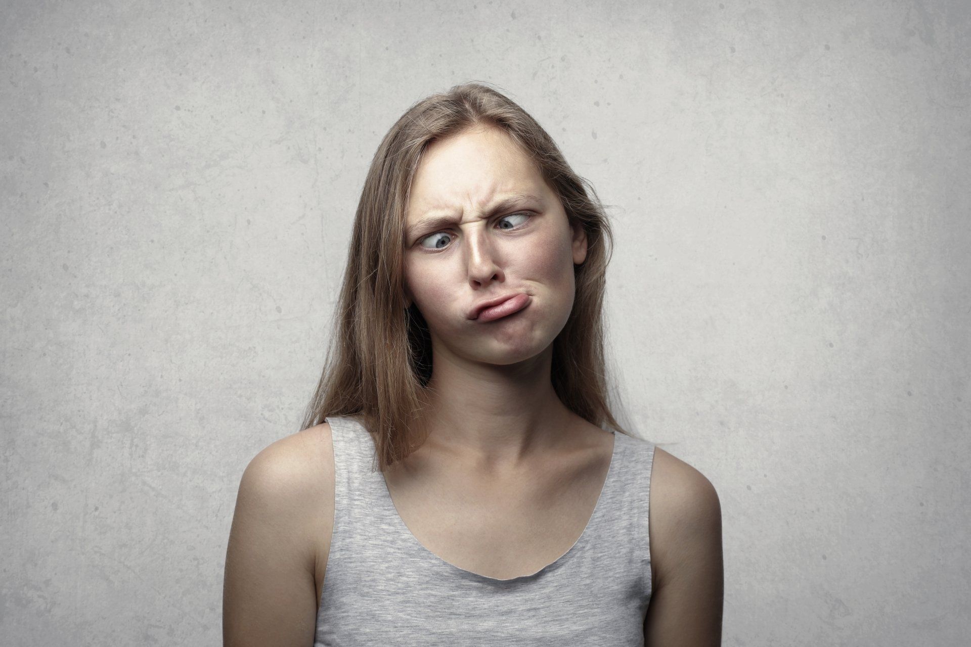 A woman pulling a goofy face