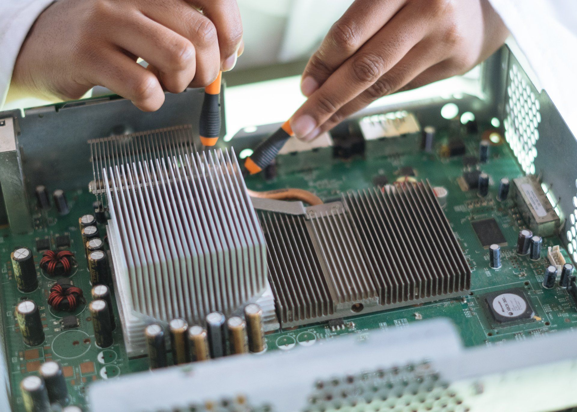Tech fixes motherboard in service center