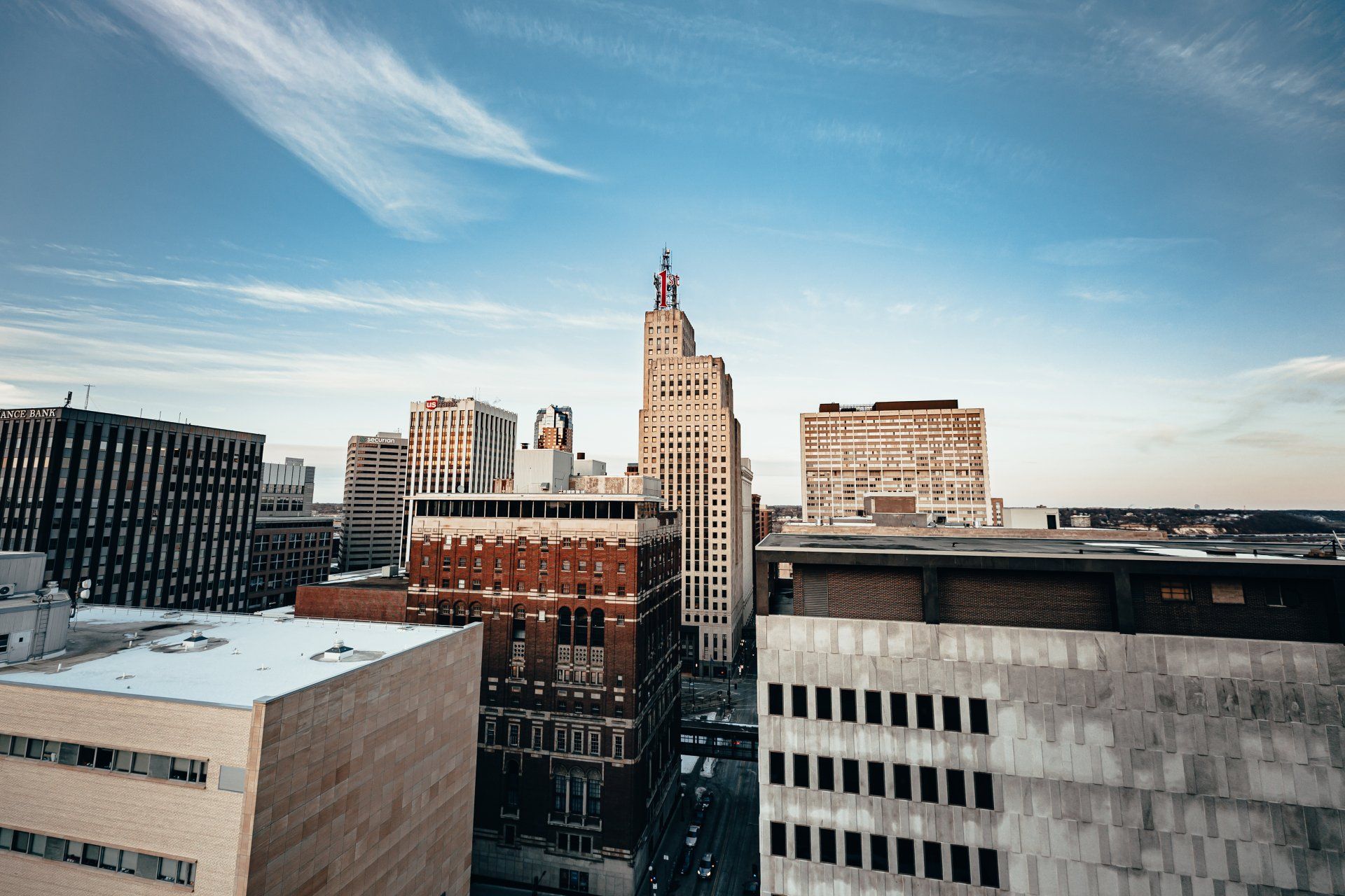 an aerial view of a city skyline with a clock tower in the middle