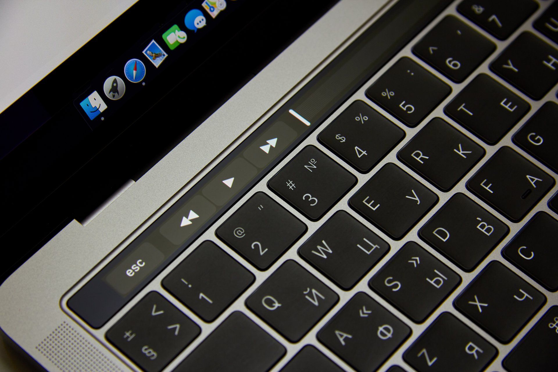 A close up of a laptop keyboard with the esc key visible