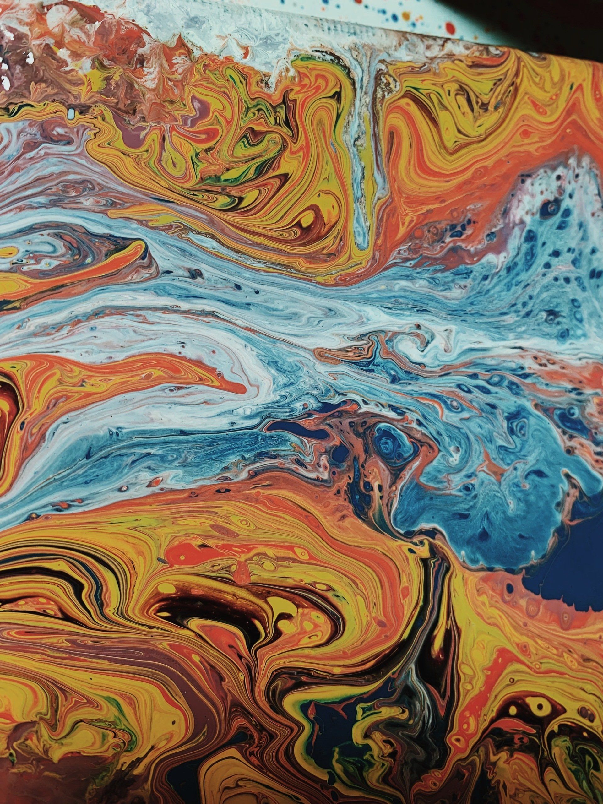 A close up of a colorful marble painting on a table.