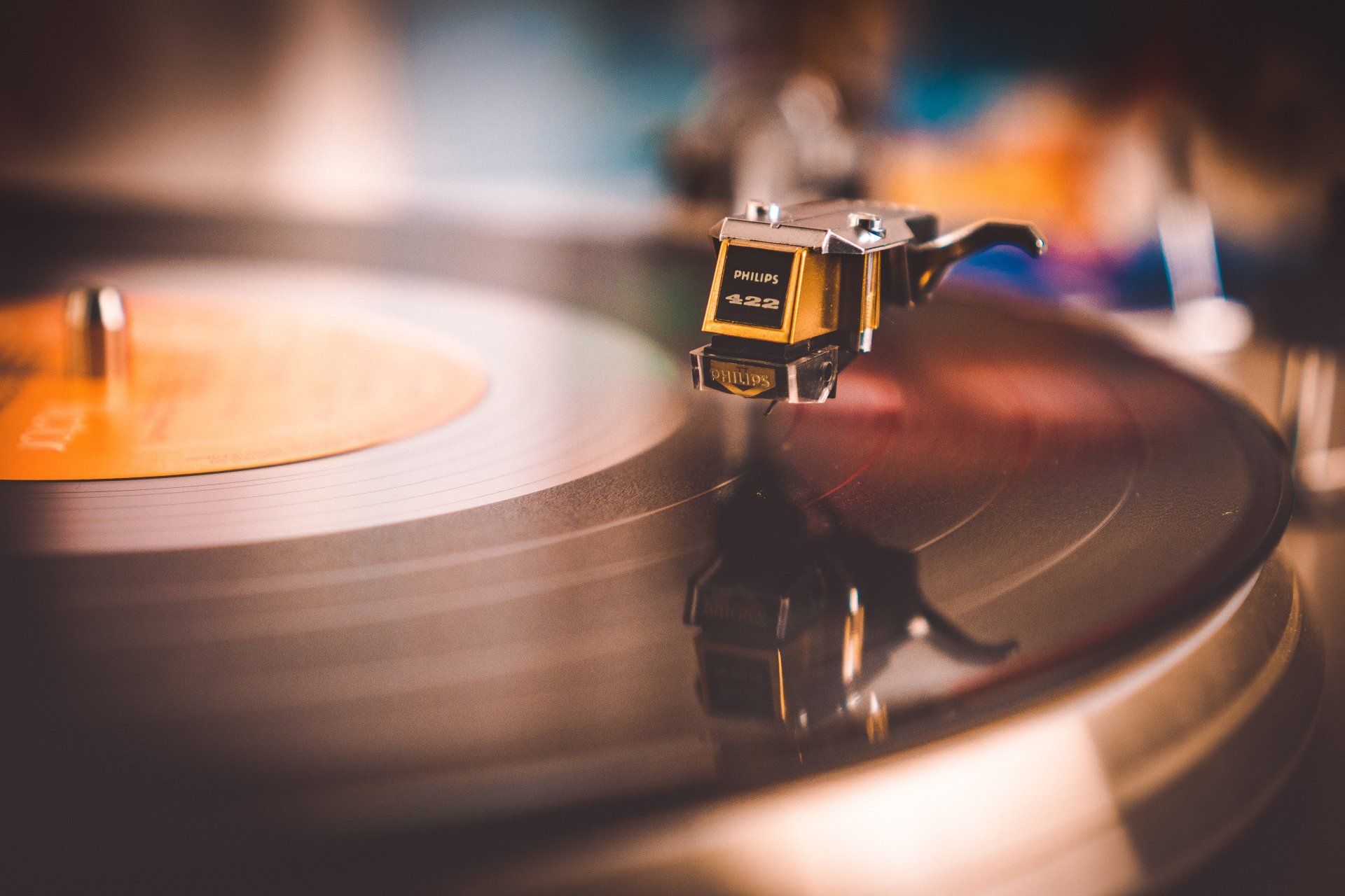 A close up of a record player playing a record
