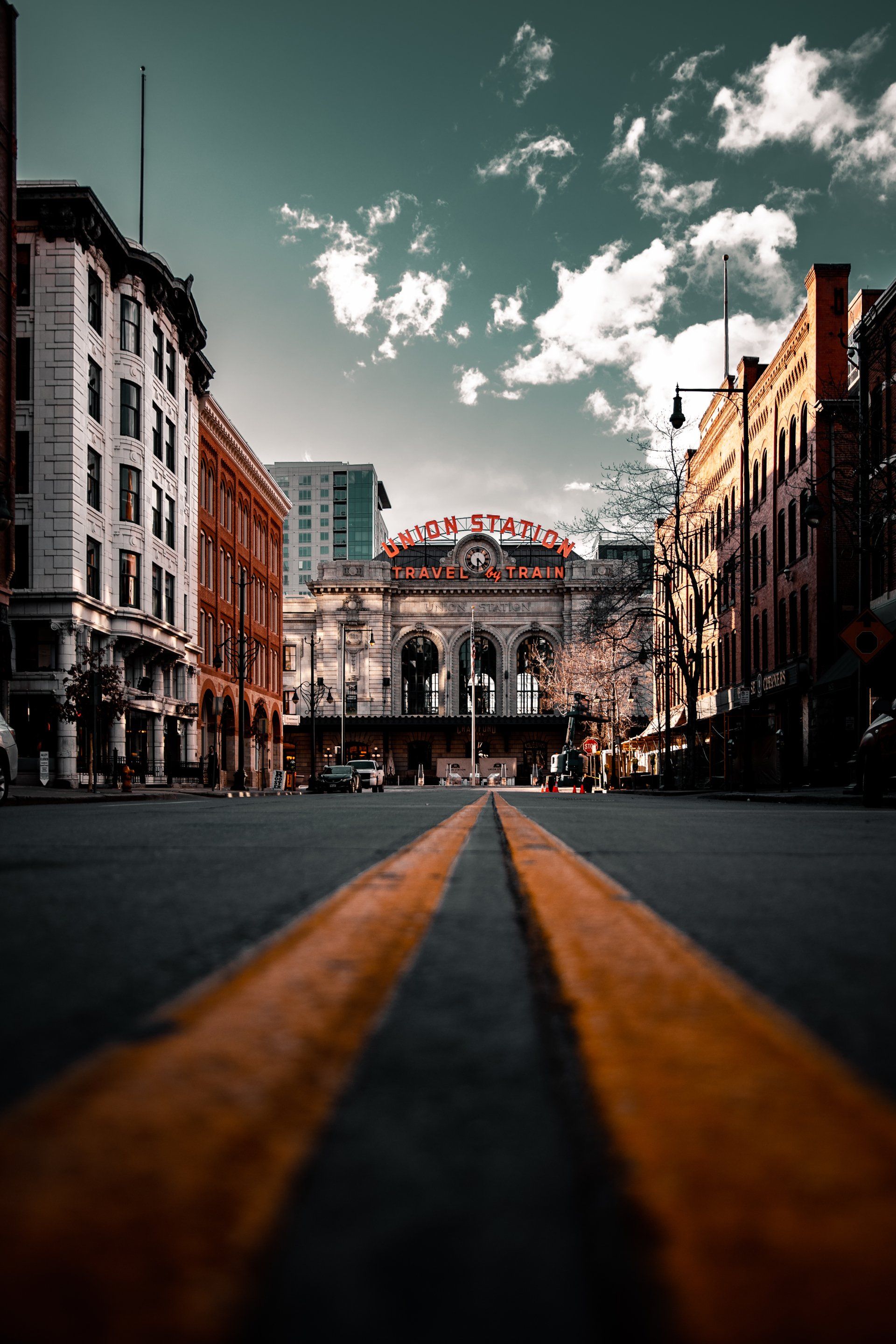 A view of a city street with a building in the background.