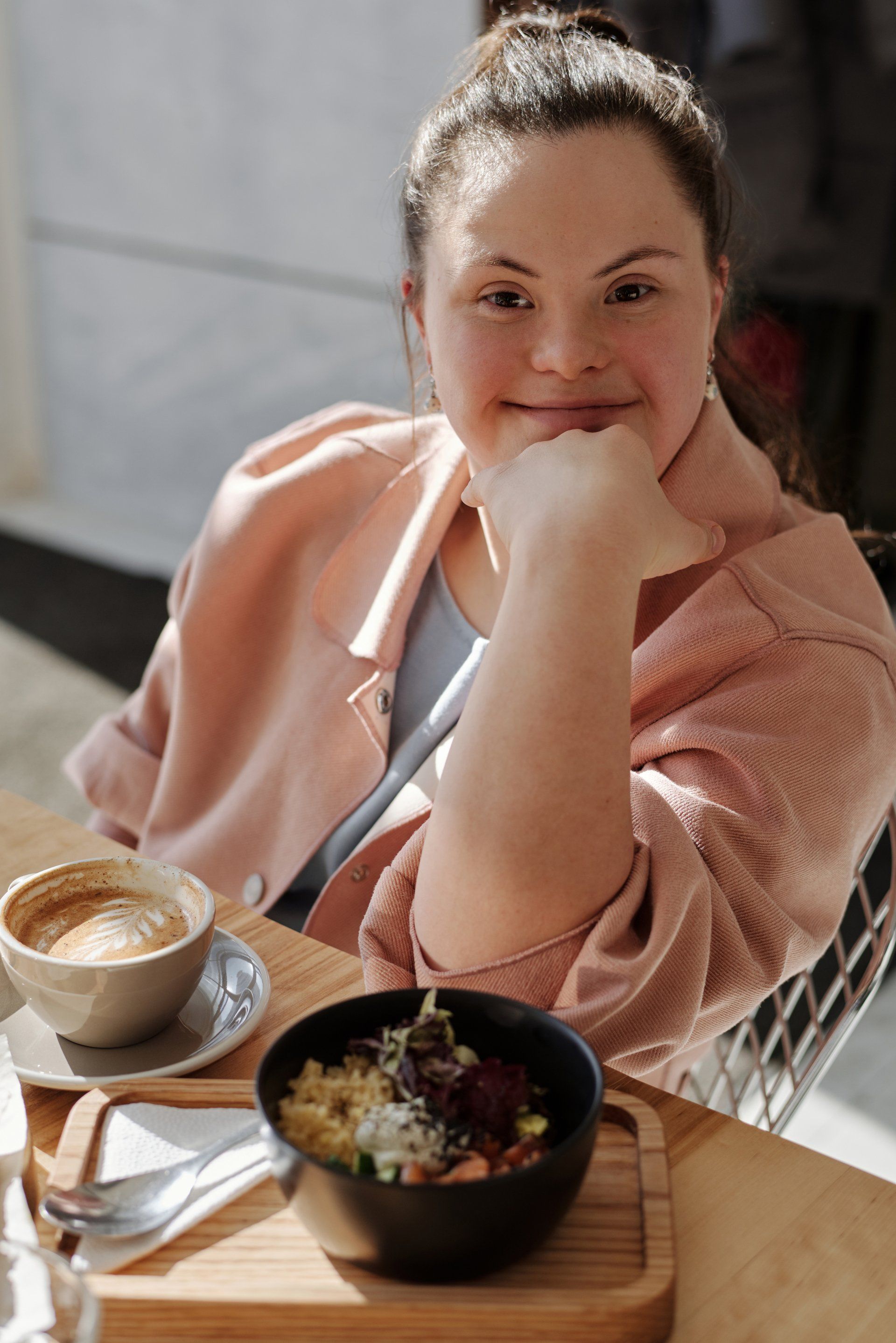 Satisfaction derived from exceptional plan management solutions. Happy NDIS participant lady smiling warmly, showcasing the positive impact of our plan management services.