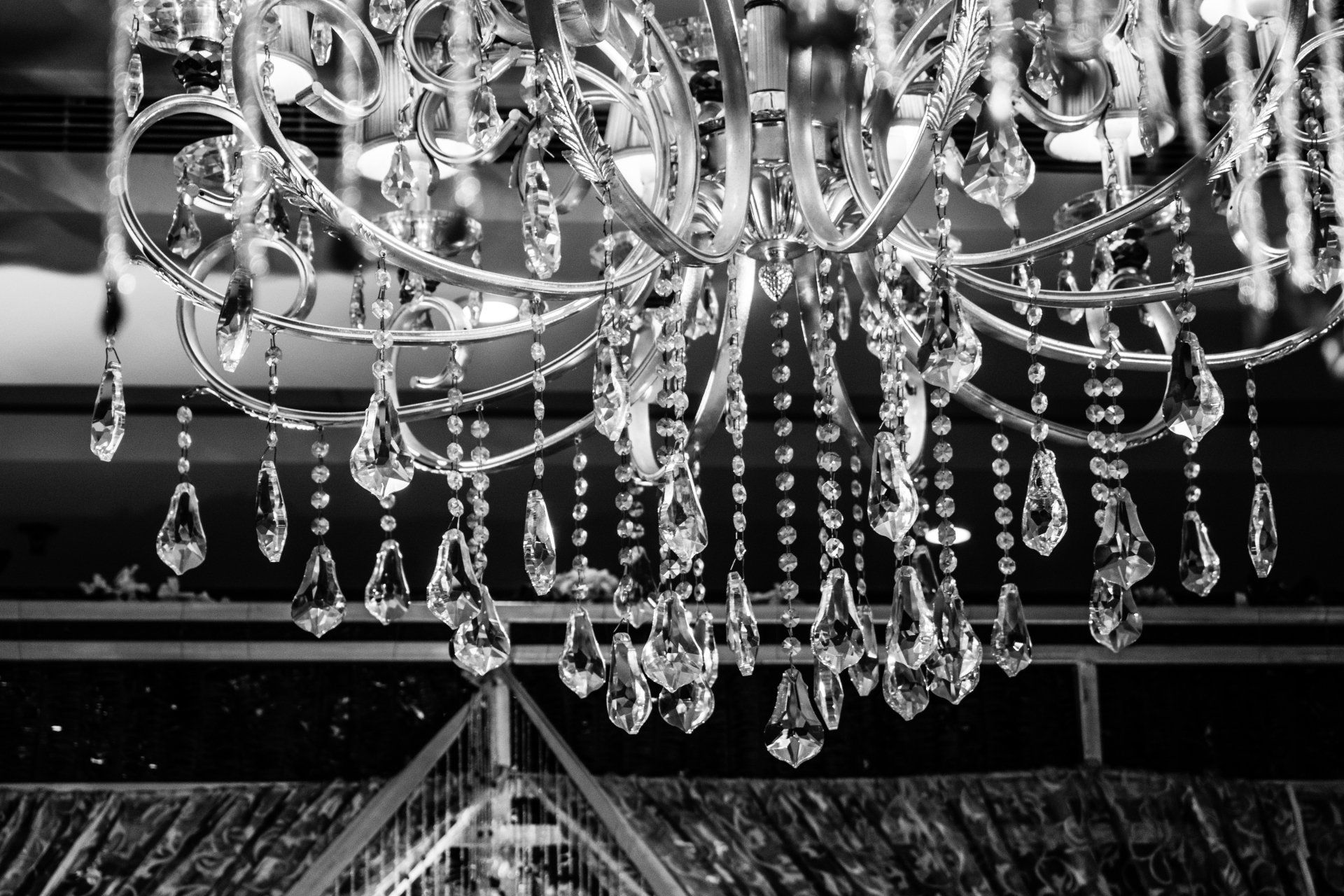 An ornate chandelier with hanging crystals. An ornate chandelier with hanging crystals.
