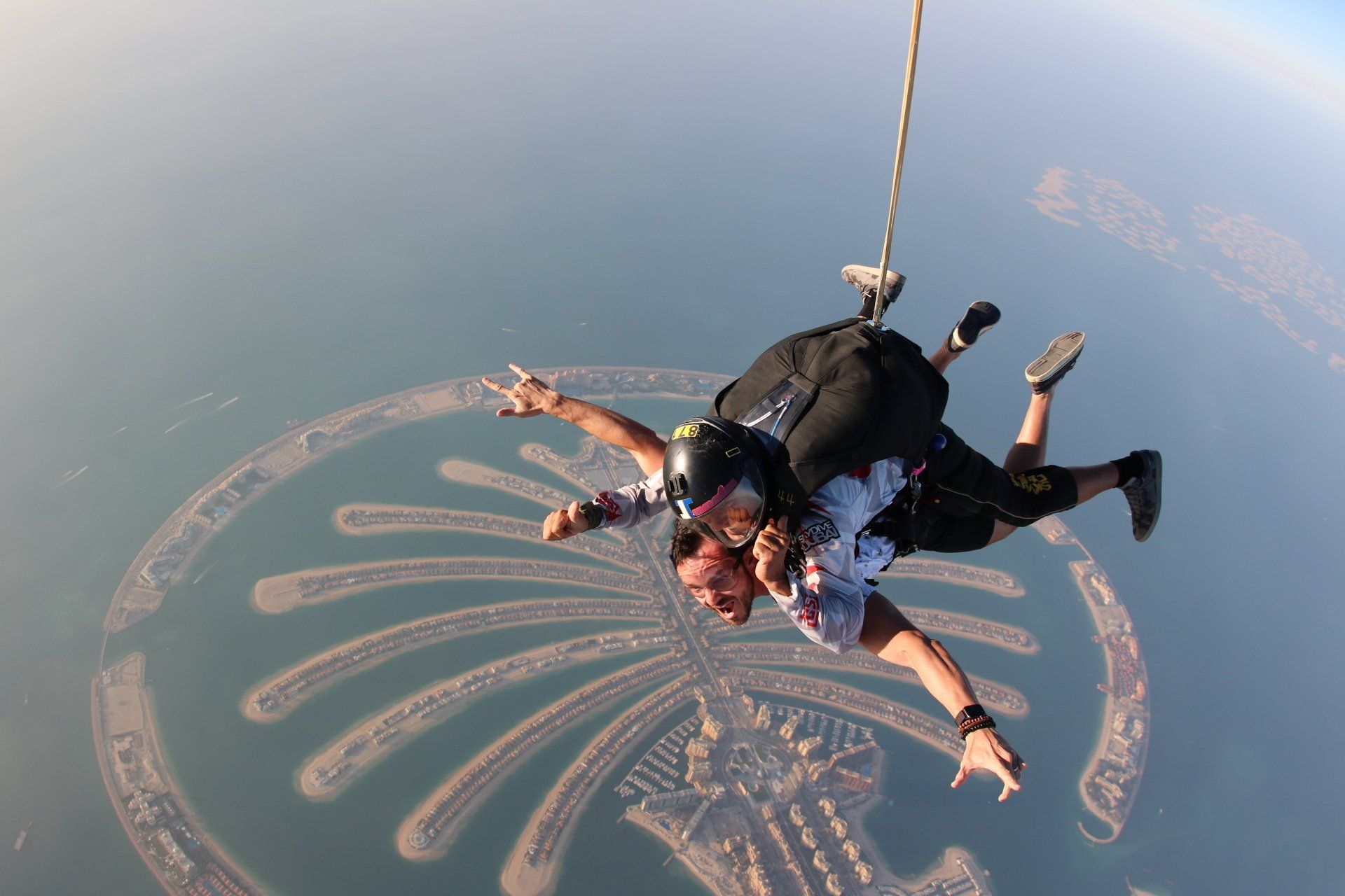 A man and a woman are flying through the air.