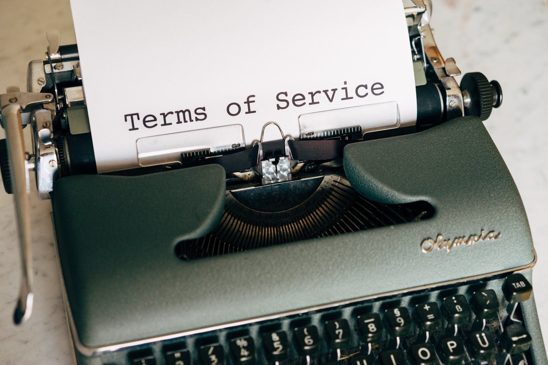 A typewriter with the words terms of service written on it