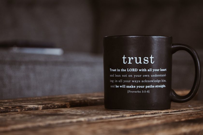 Black mug on wood table with