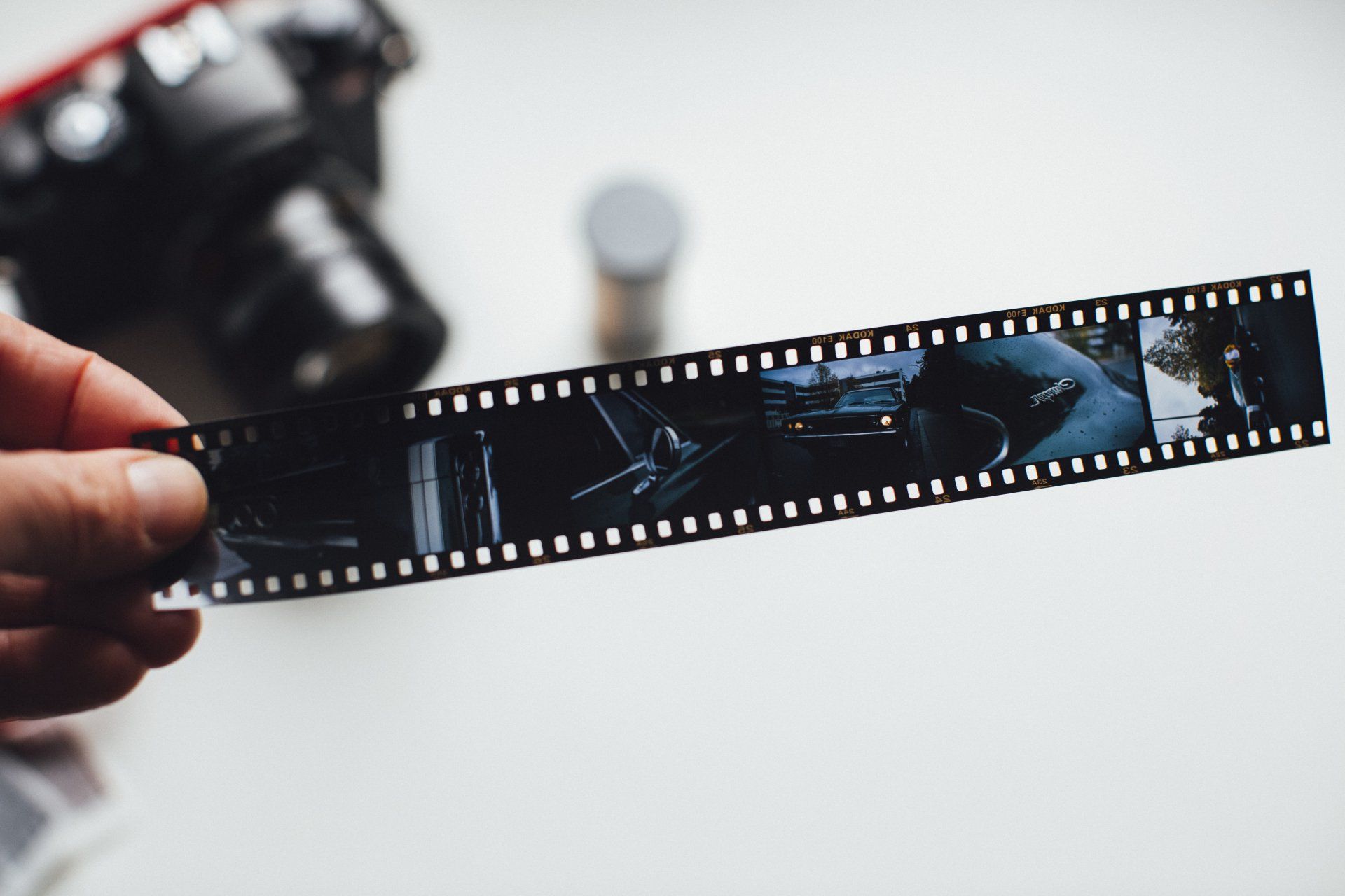 a person is holding a roll of film in their hand .