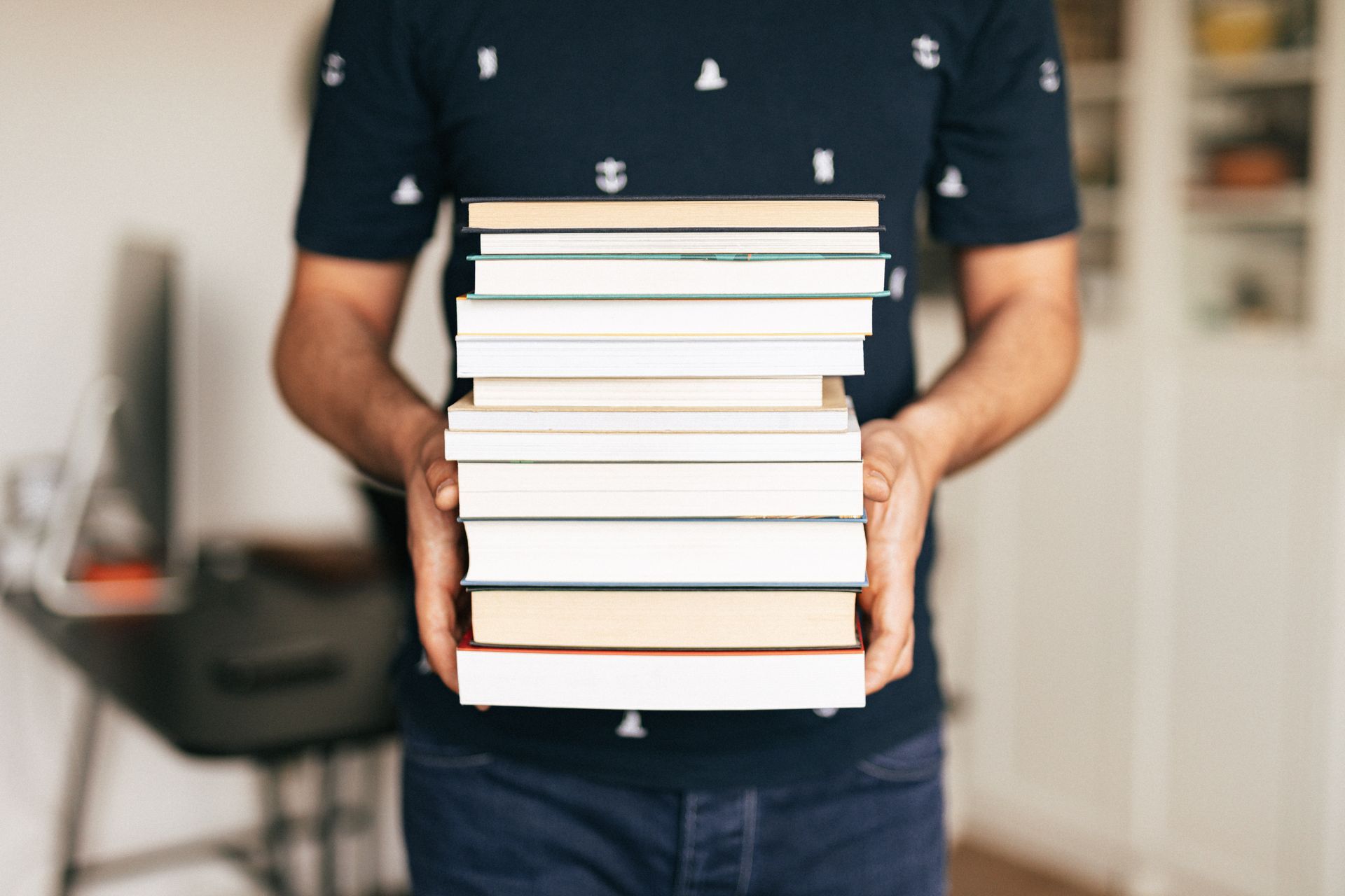 image of a gryphon publishing consulting client holding numerous books