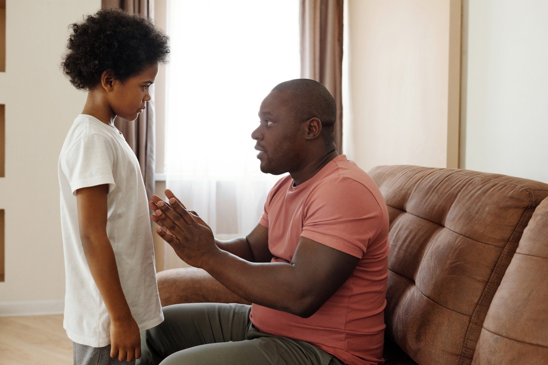 image of a man talking to his child