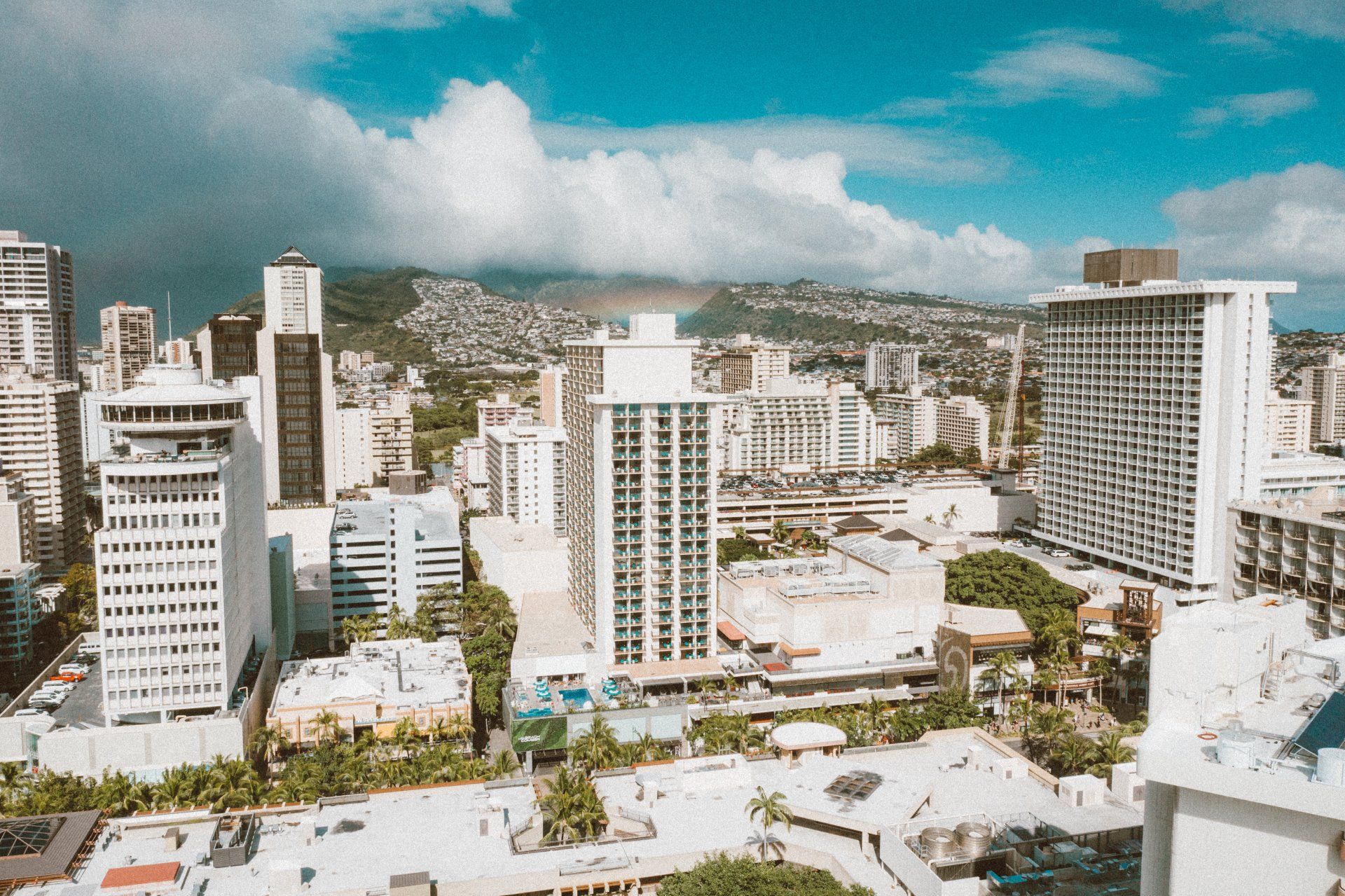 An aerial view of a city with lots of buildings and trees.