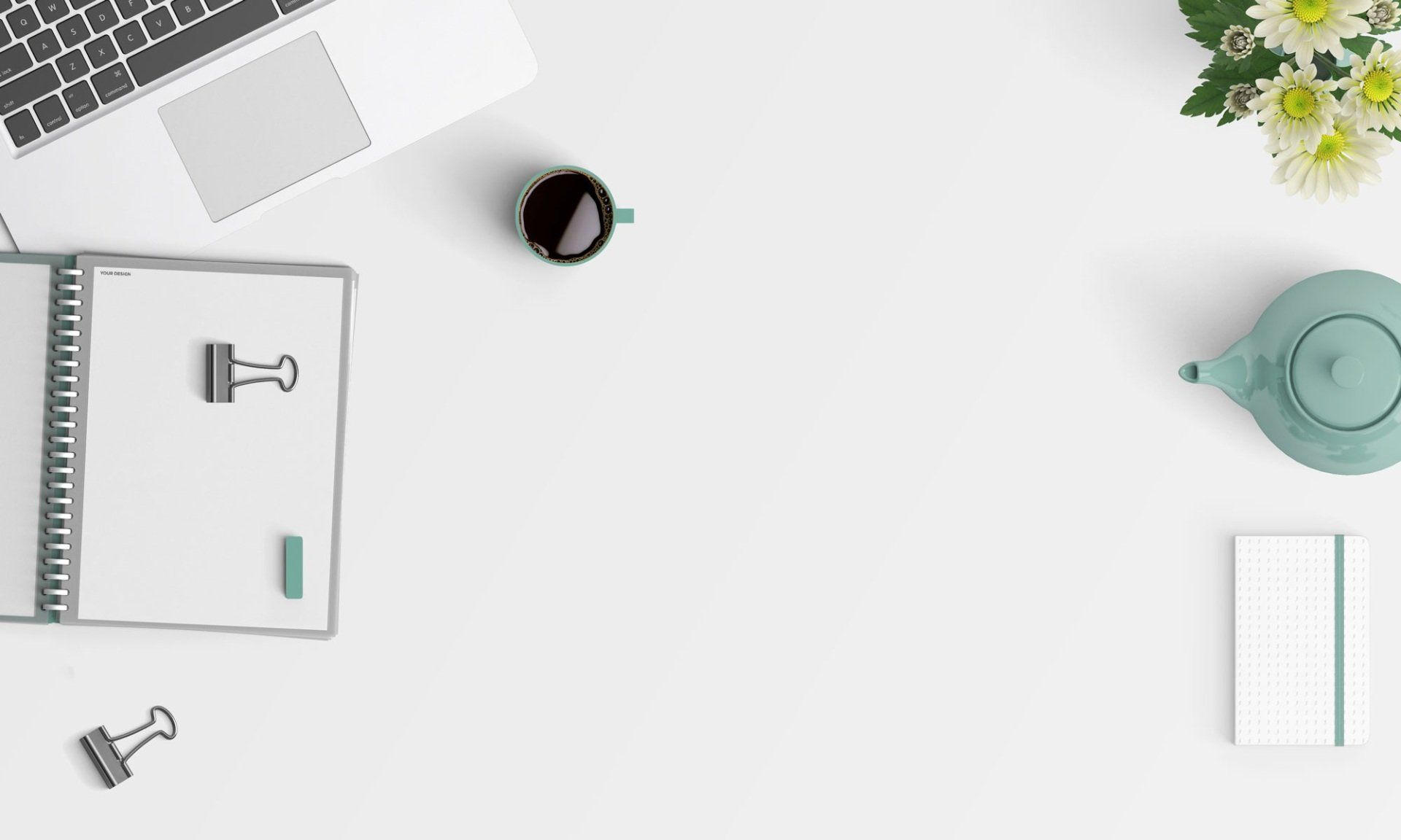 A white desk with a laptop , notebook , cup of coffee , teapot and flowers.
