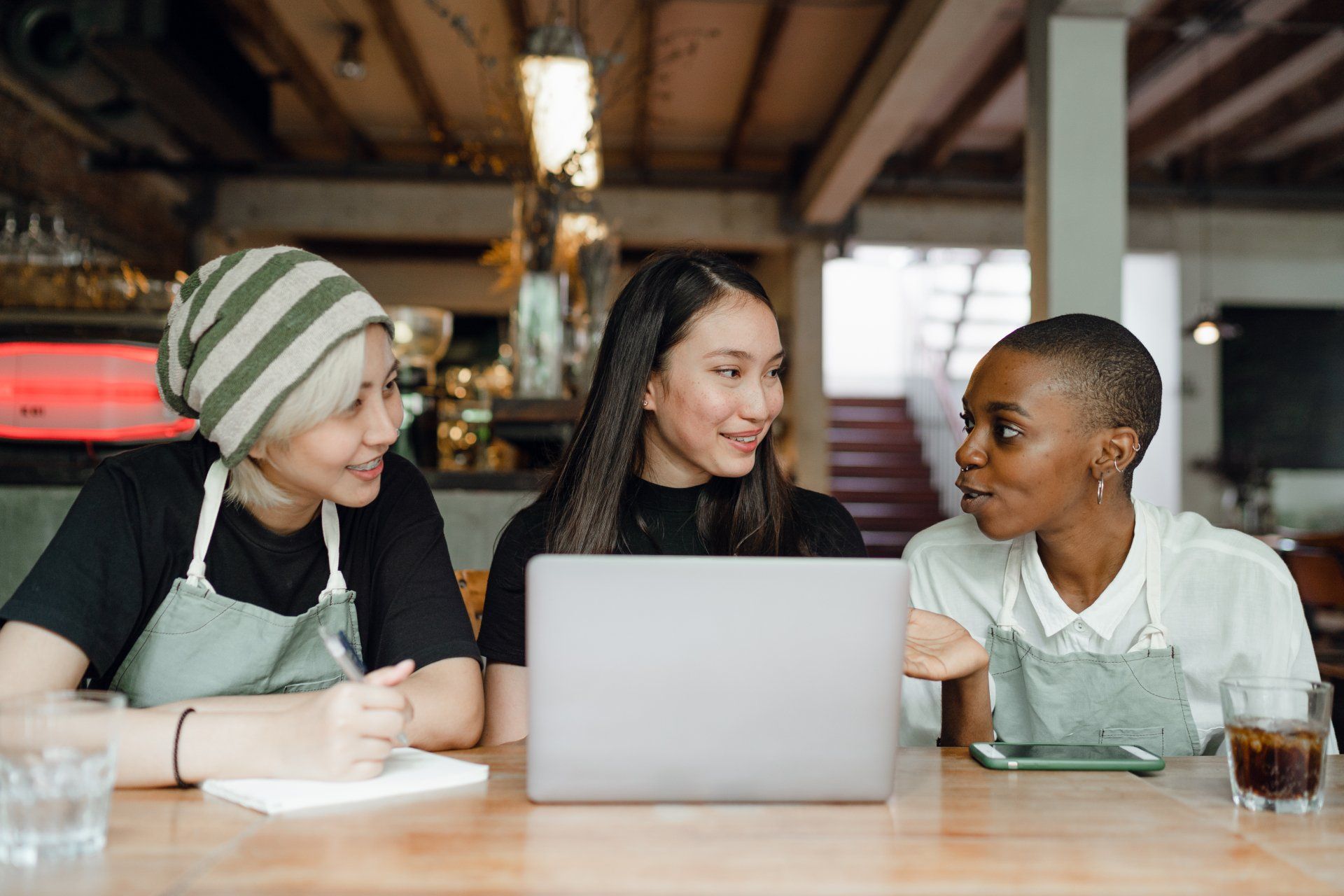 two women talking to restaurant POS reseller
