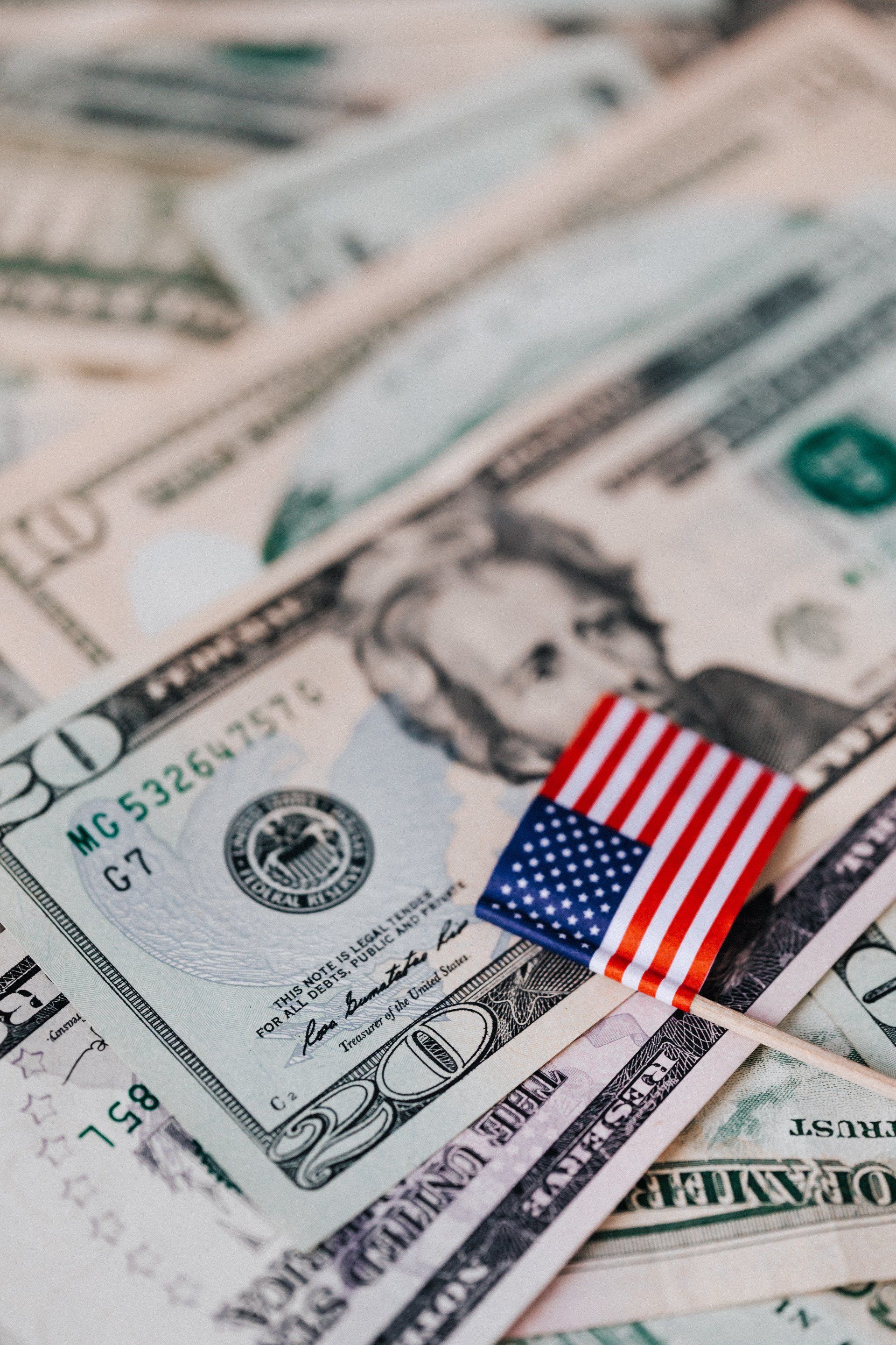 Close-up image of the US Dollar bill, symbolizing the economic landscape and job market.