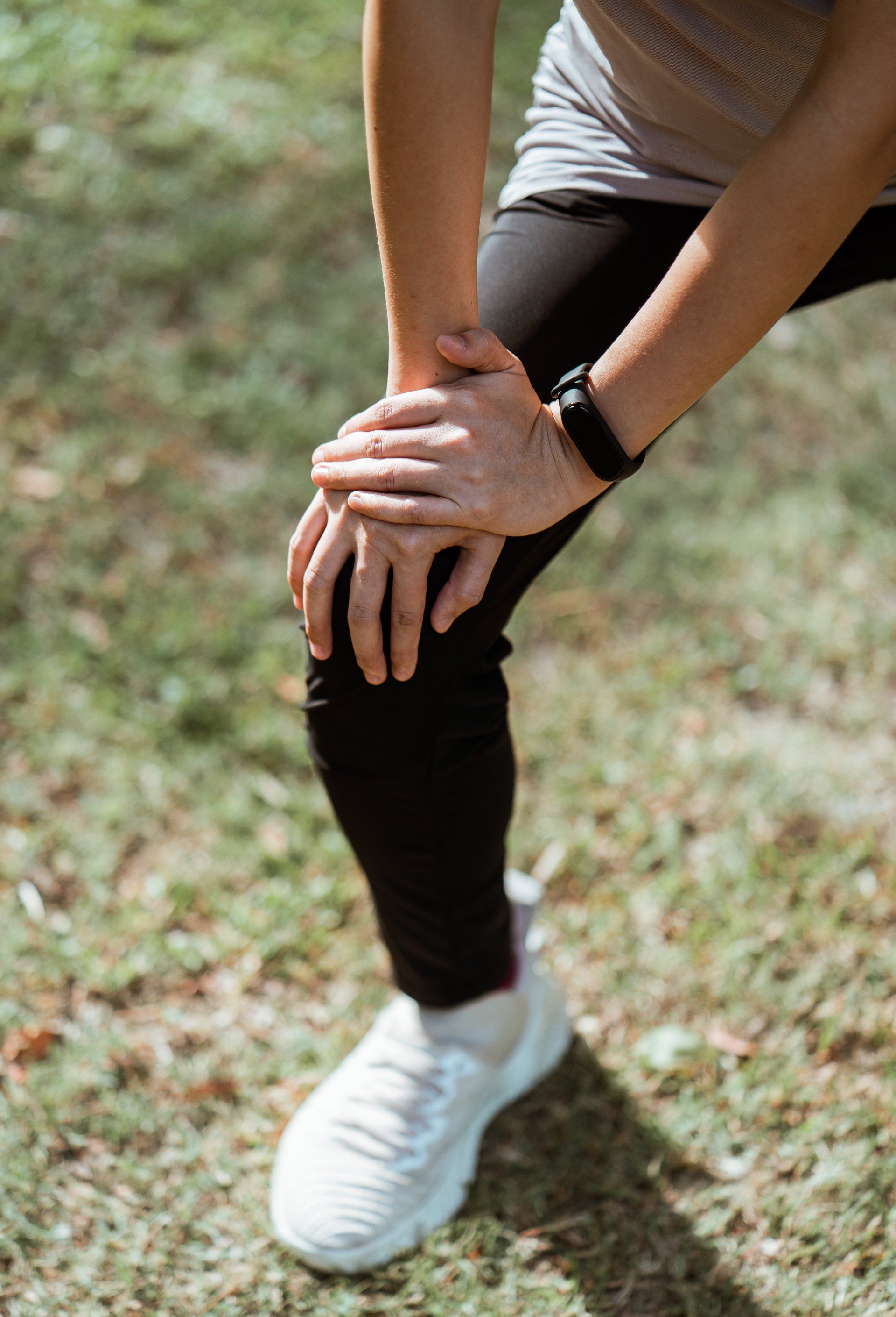 Hands on sore knee