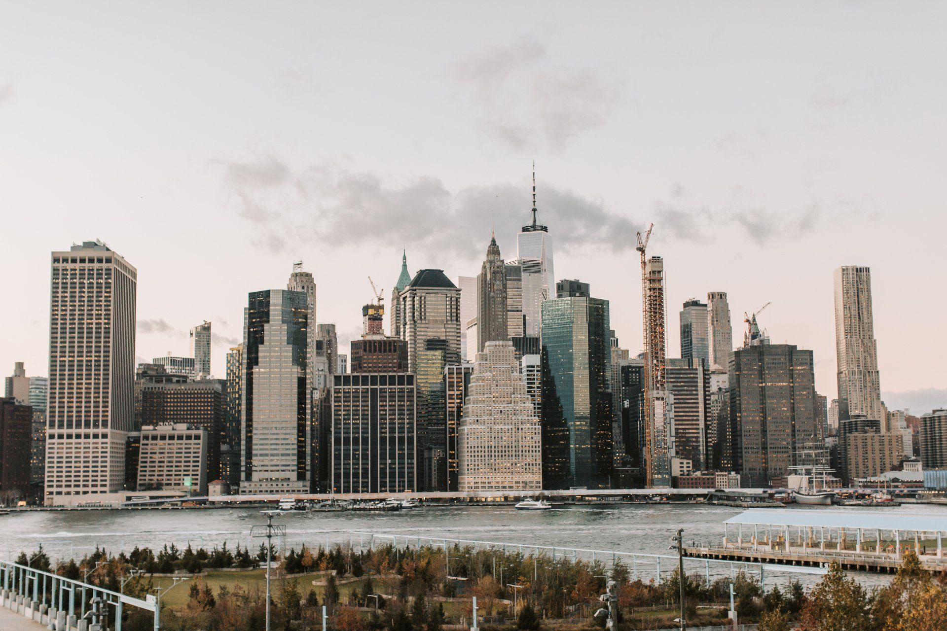 A city skyline with a river in the foreground