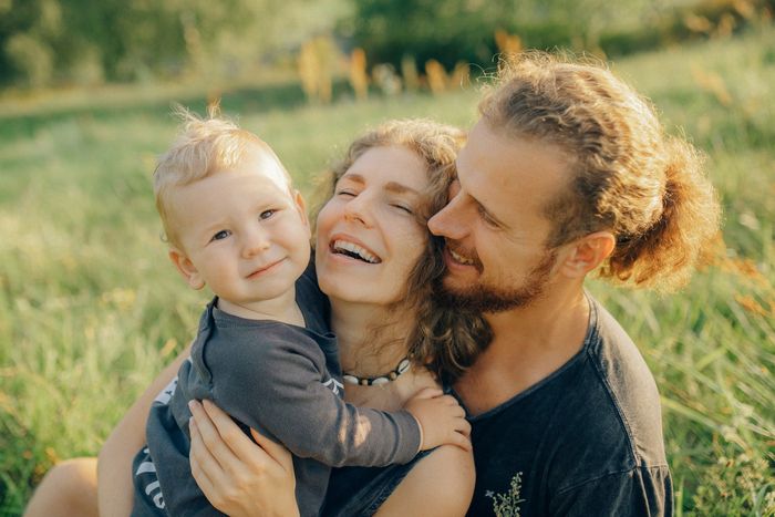 couple with child in grass