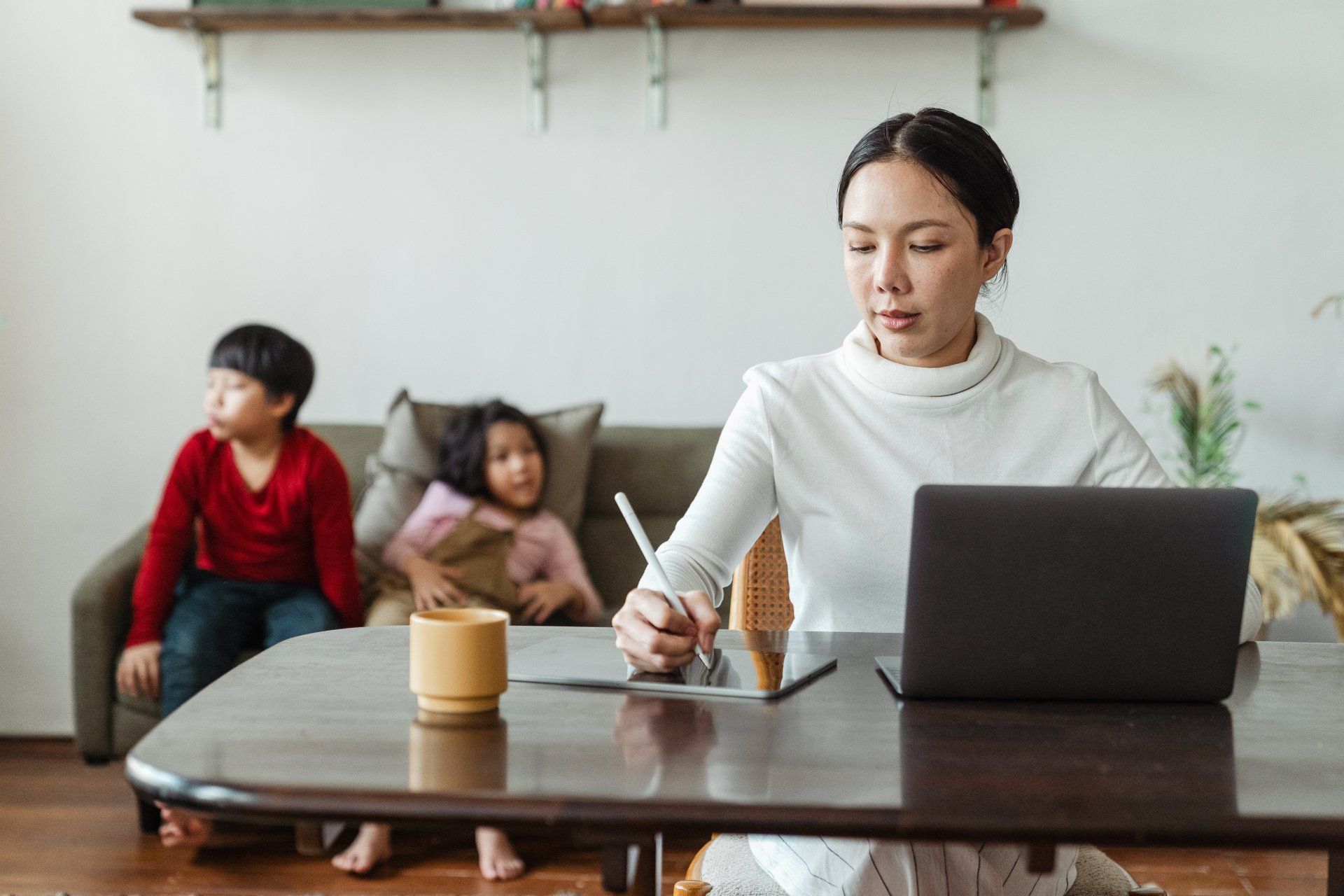 Busy mom working with kids