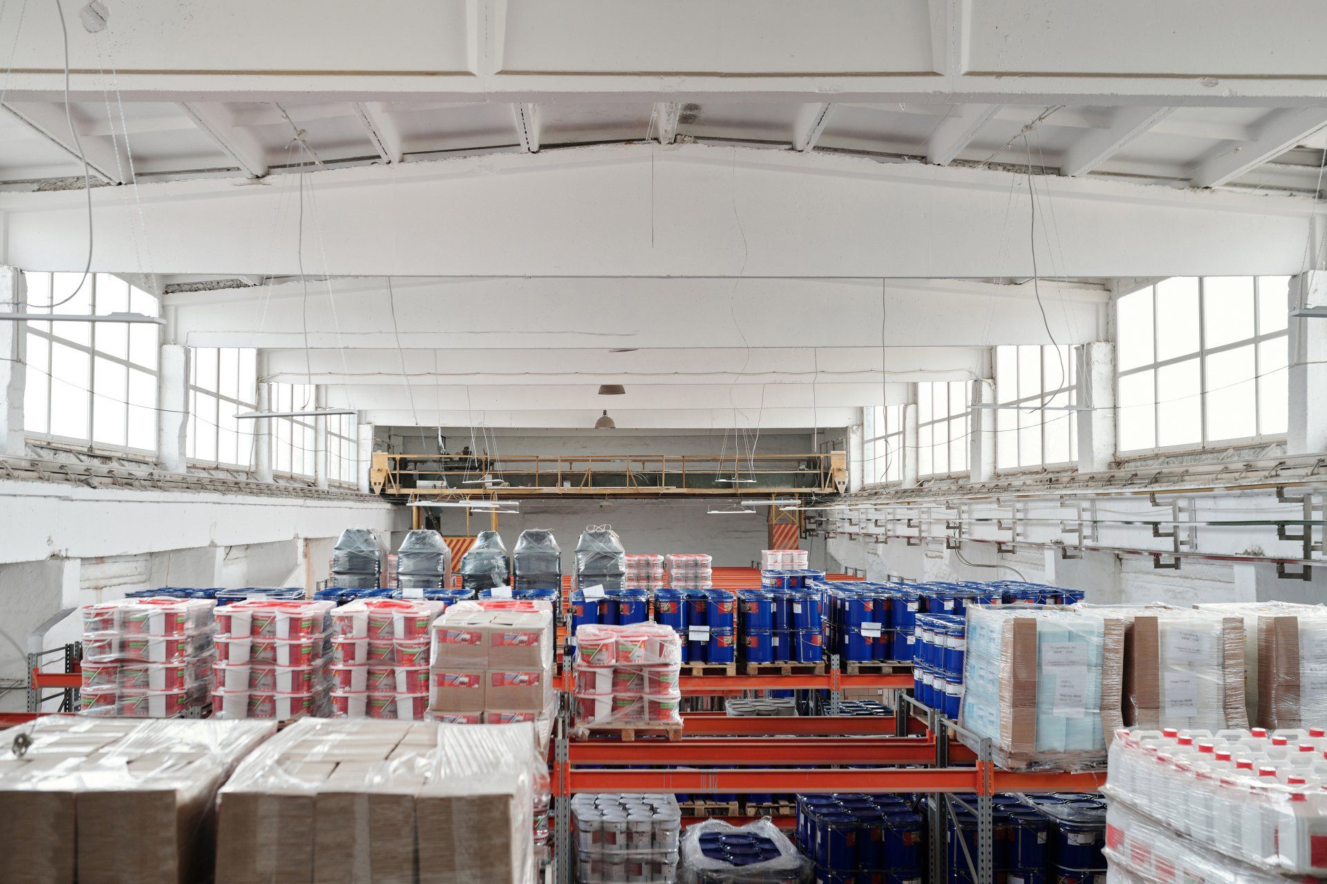 A large warehouse filled with lots of boxes and bottles.