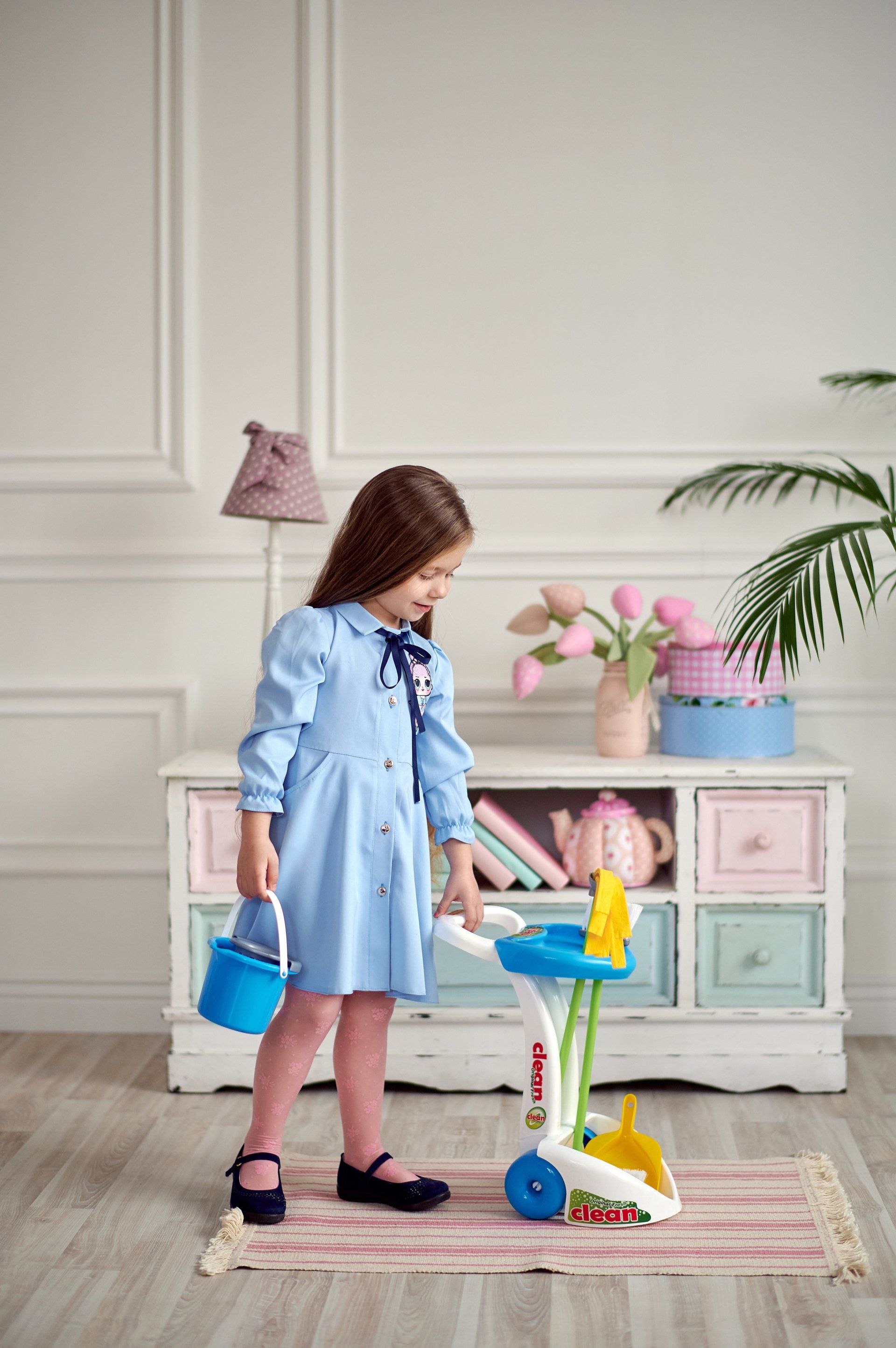 a child helping with cleaning