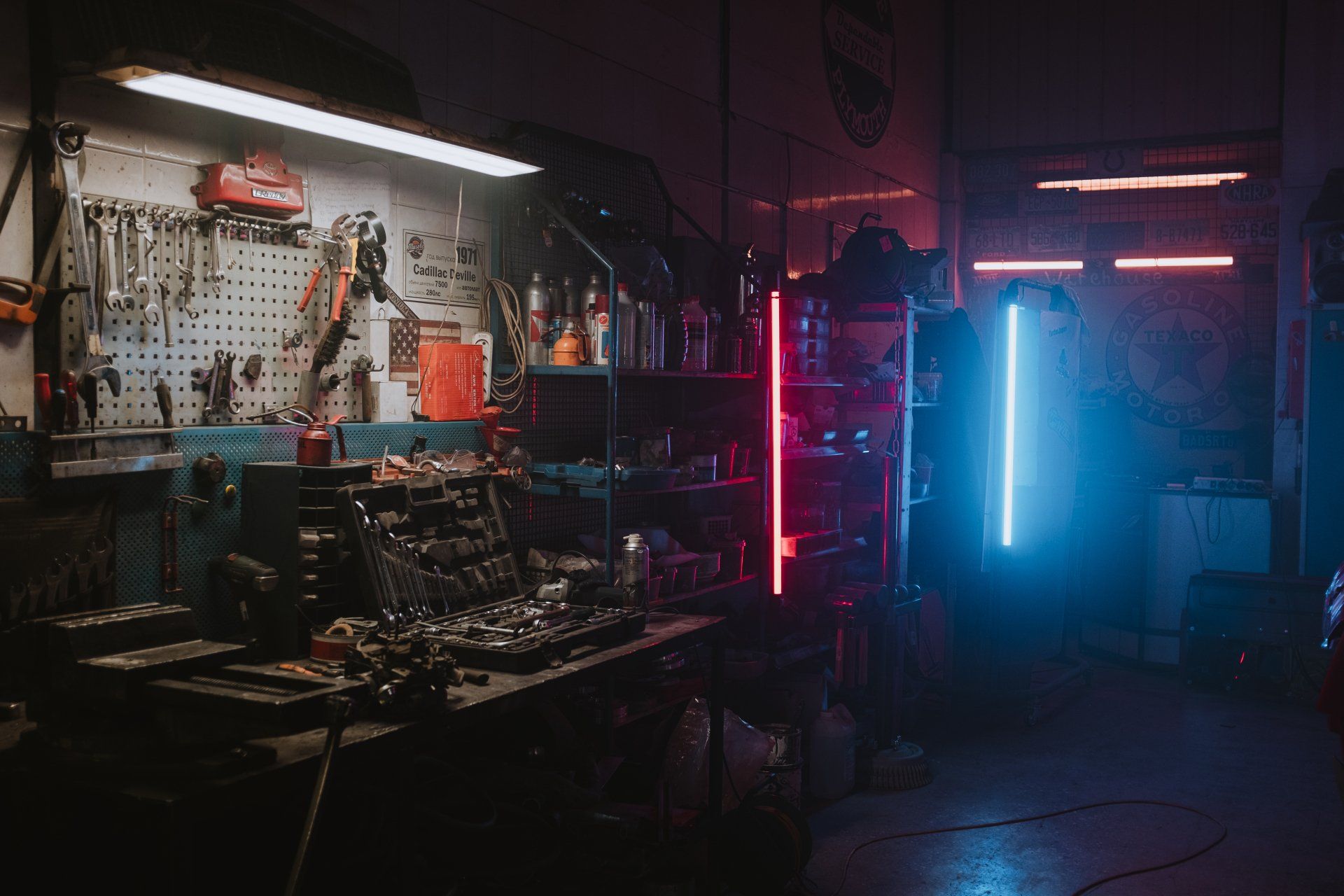 a poorly lit garage with so many tools