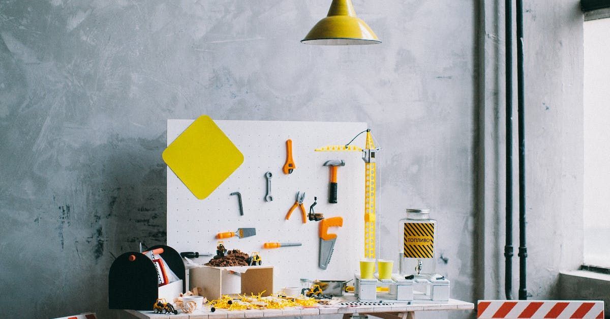 Workbench with tools and yellow lamp.