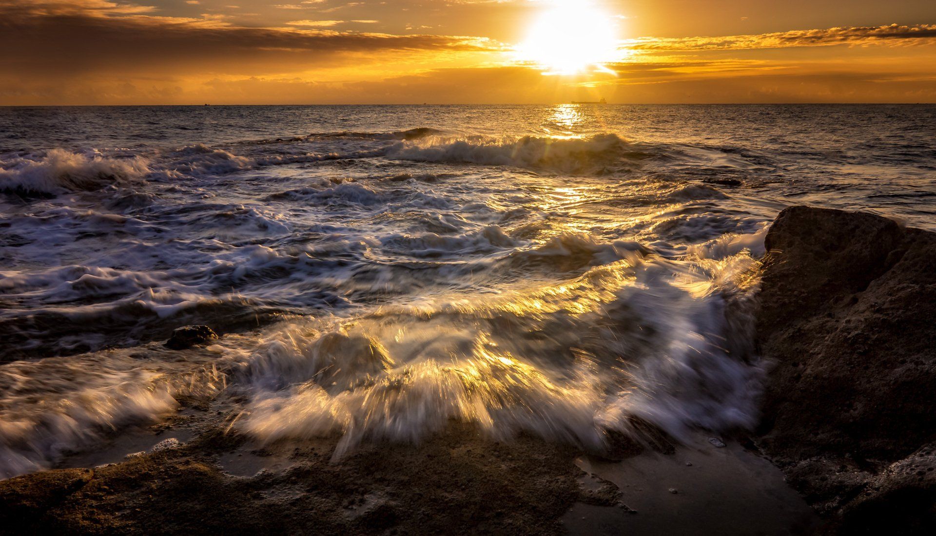 ocean waves sunset clouds