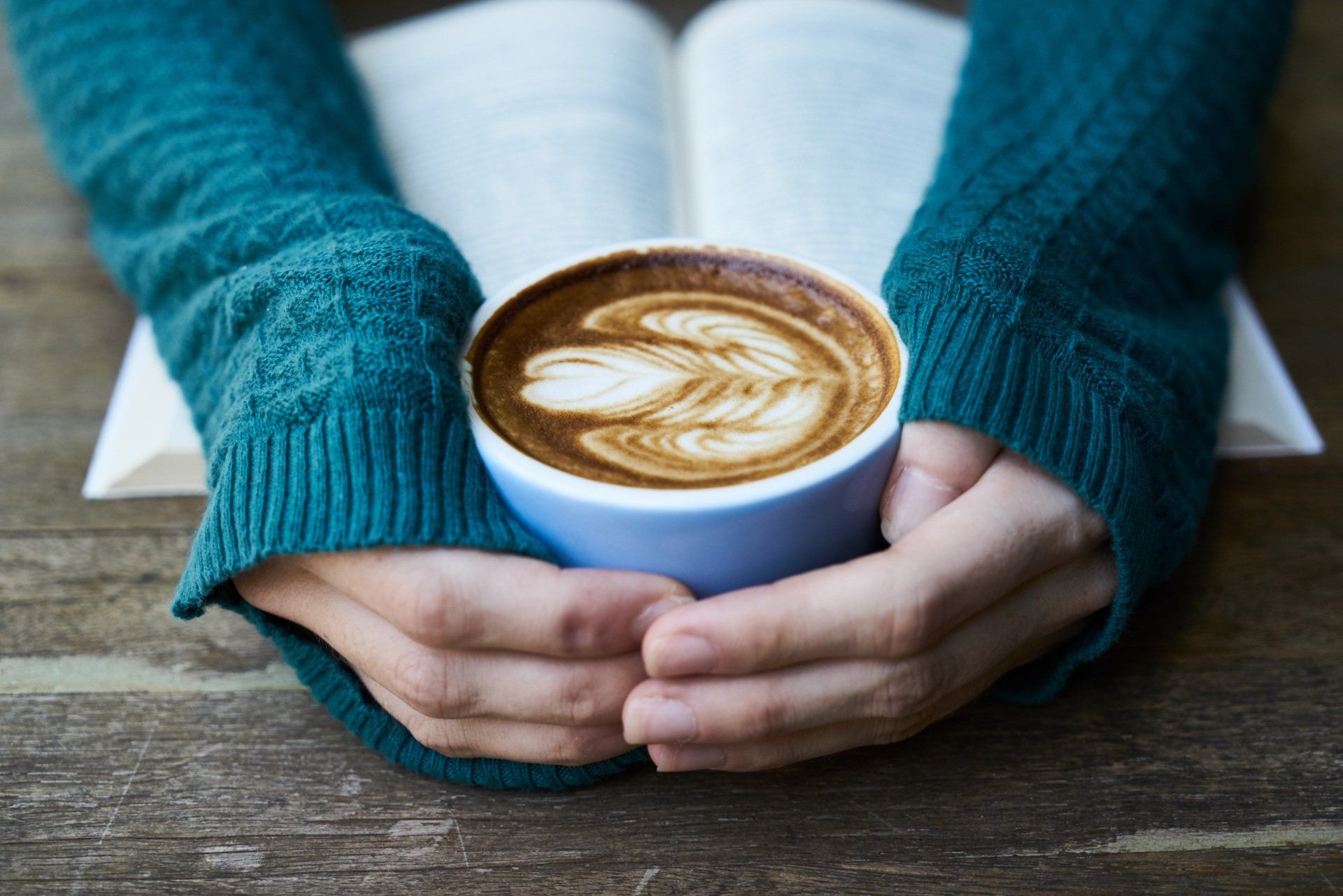 a person having a warm drink